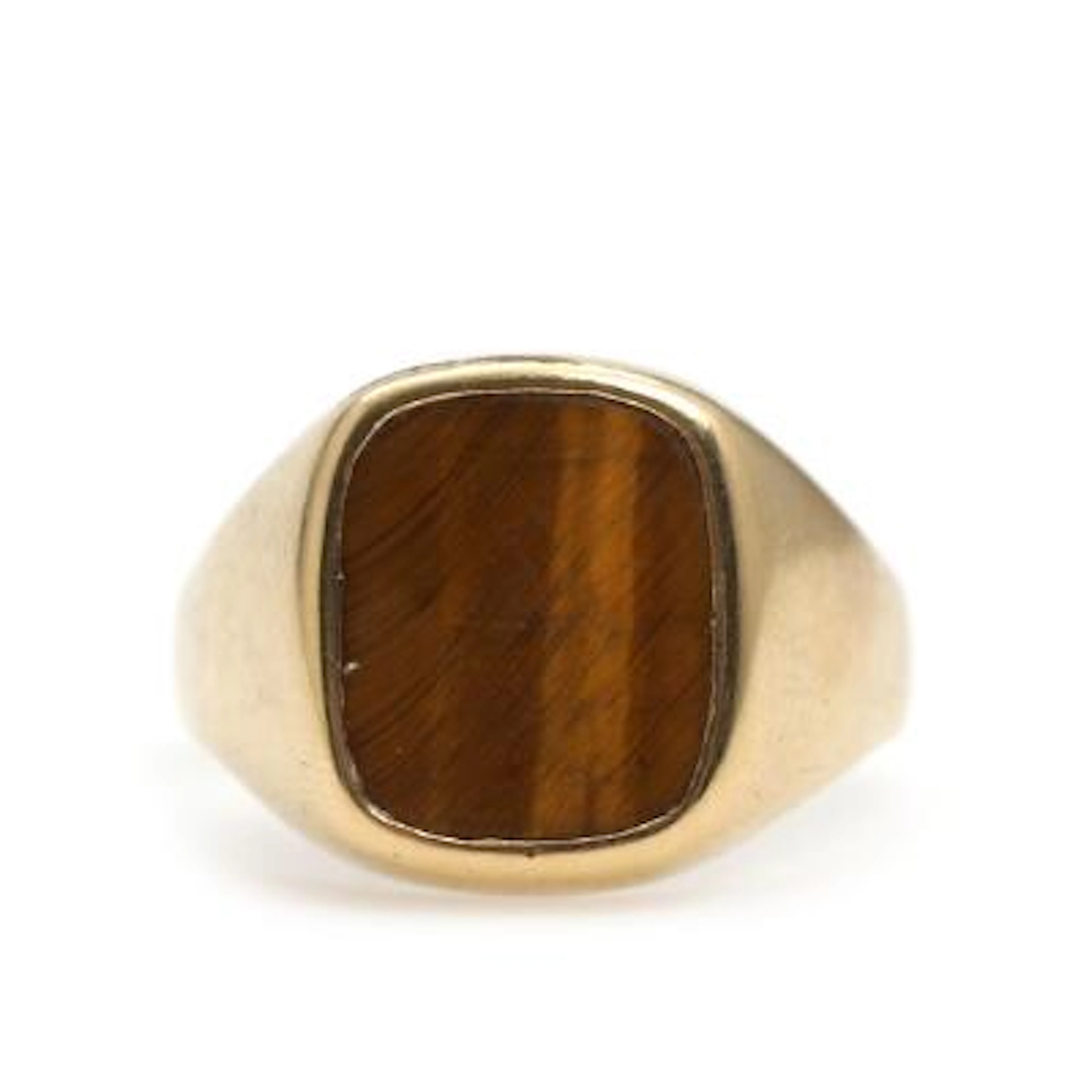 A tiger's eye ring set with polished tiger's eye, mounted in 18k gold.