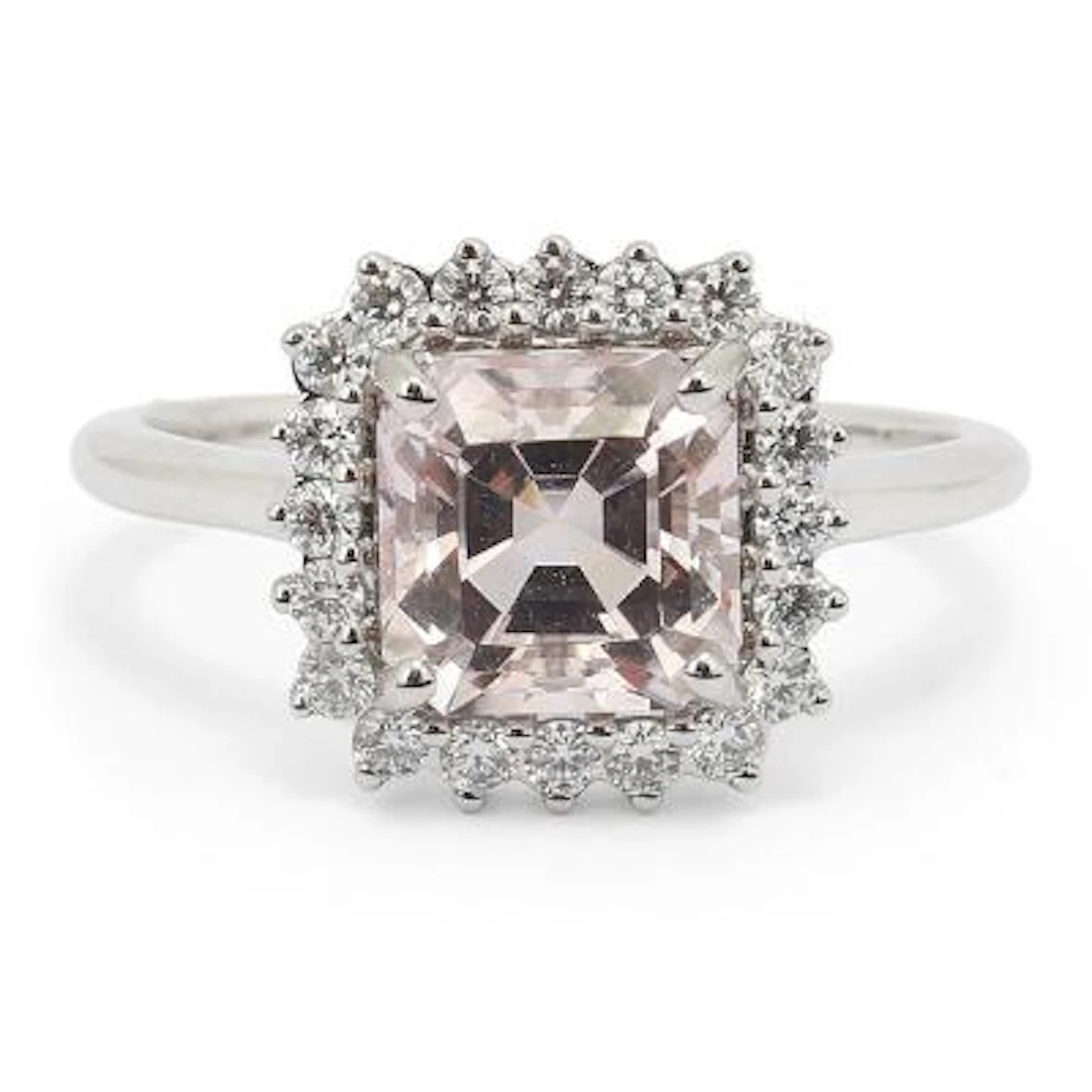 A morganite and diamond ring set with a morganite and diamonds mounted