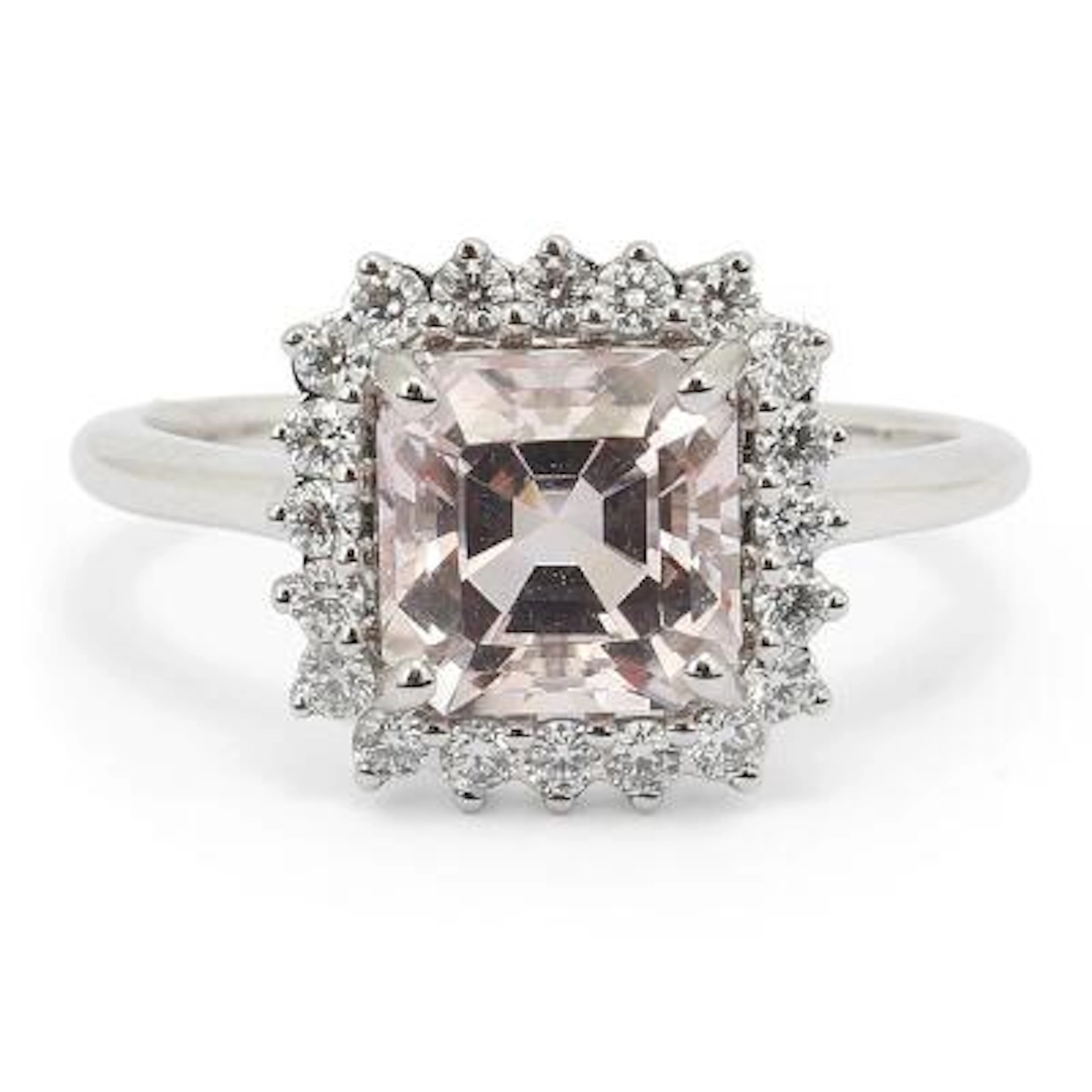 A morganite and diamond ring set with a morganite and diamonds mounted