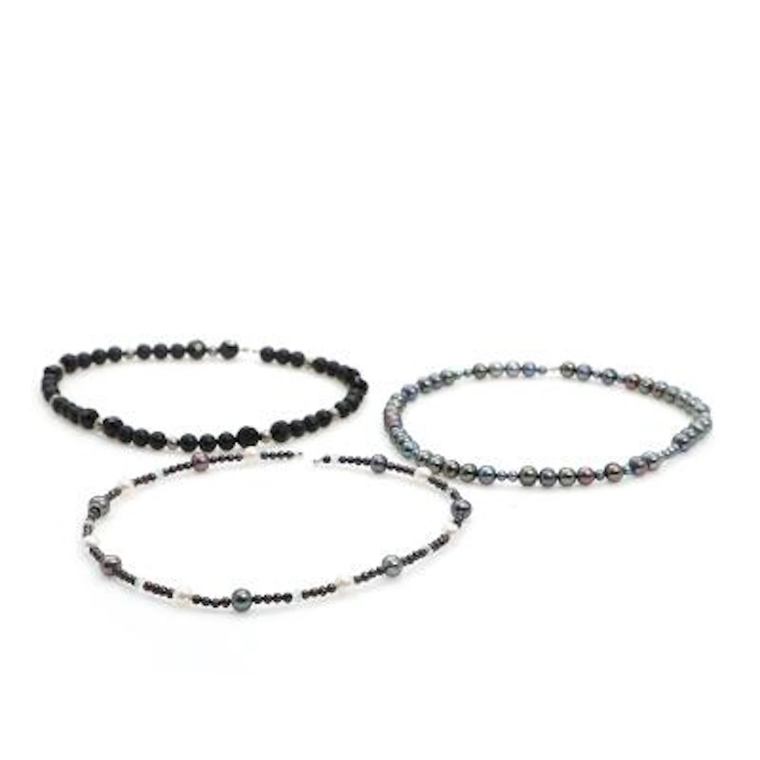 Ole Lynggaard: Three necklaces with aquamarine, onyx and freshwater