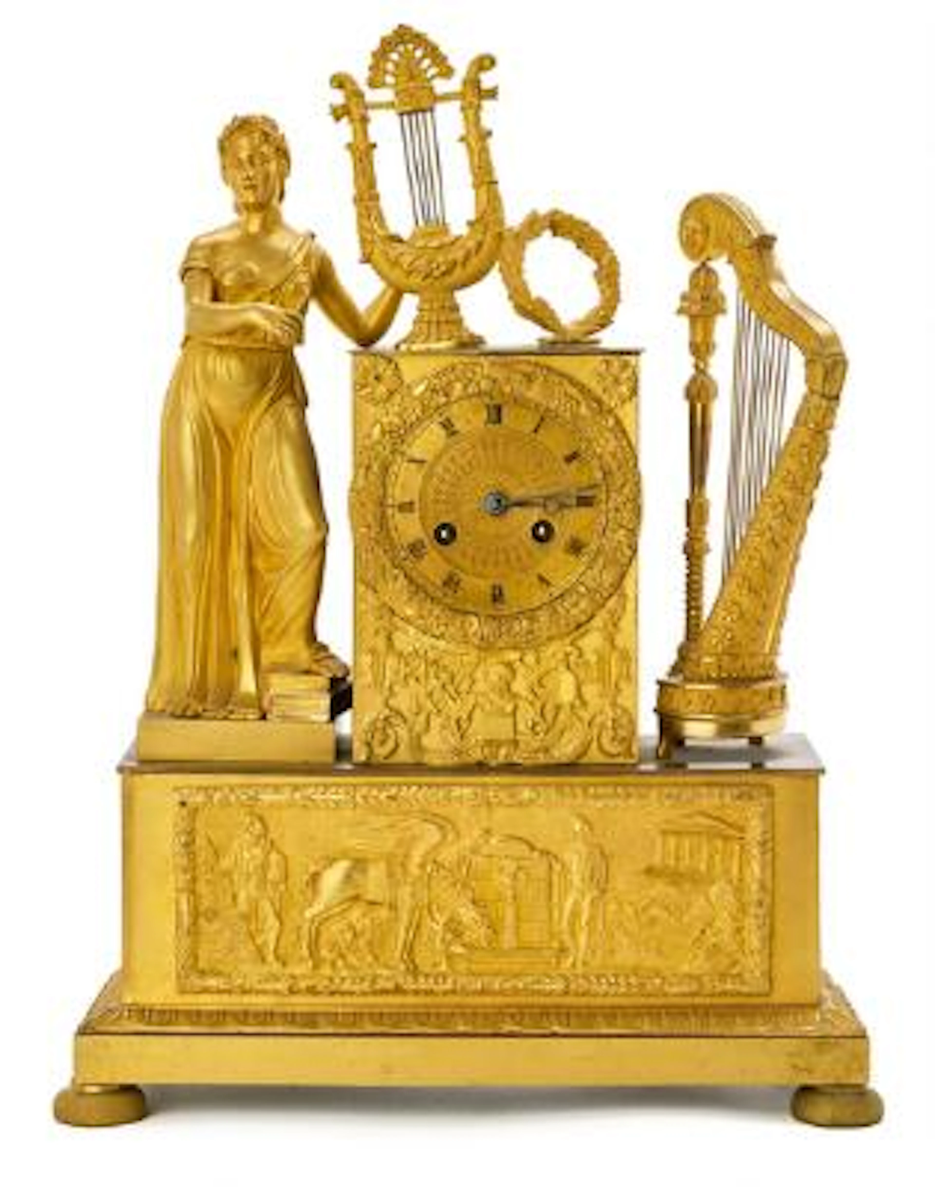 A French Empire mantel clock of gilded bronze. Early 19th century.