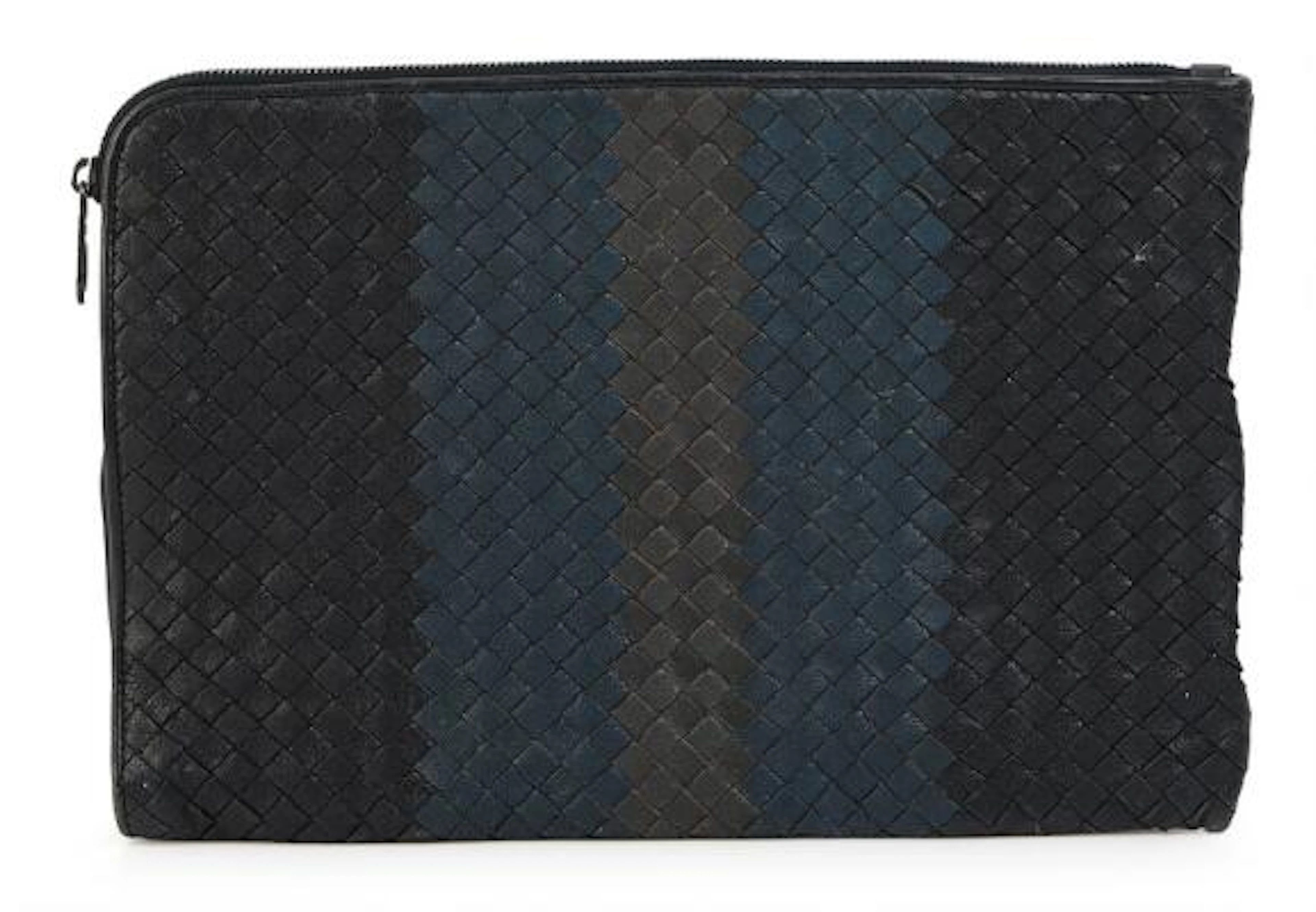 Bottega Veneta: A clutch of dark blue and black woven leather with