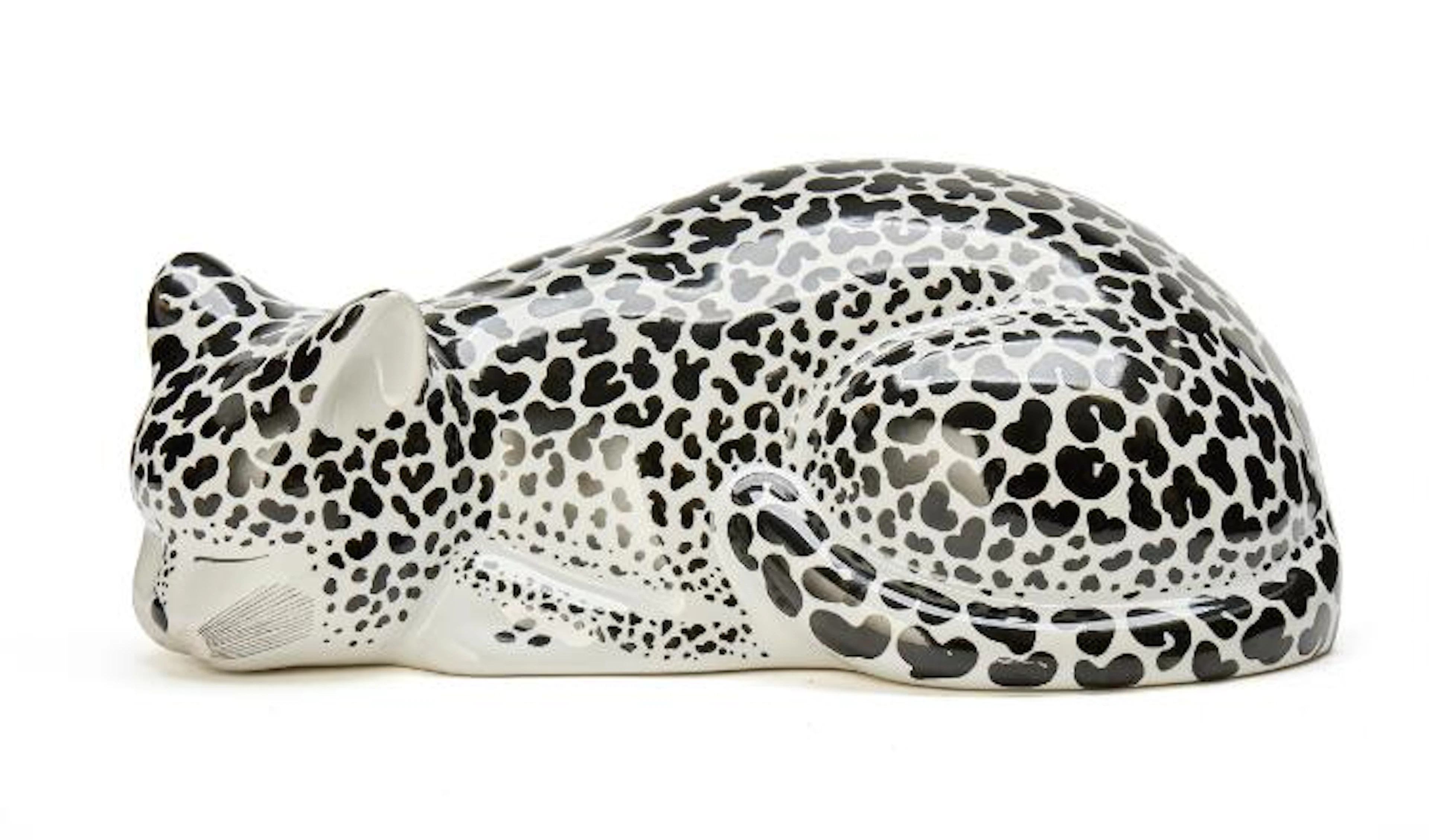 Piero Fornasetti: A porcelain figure of a reclining leopard. Decorated