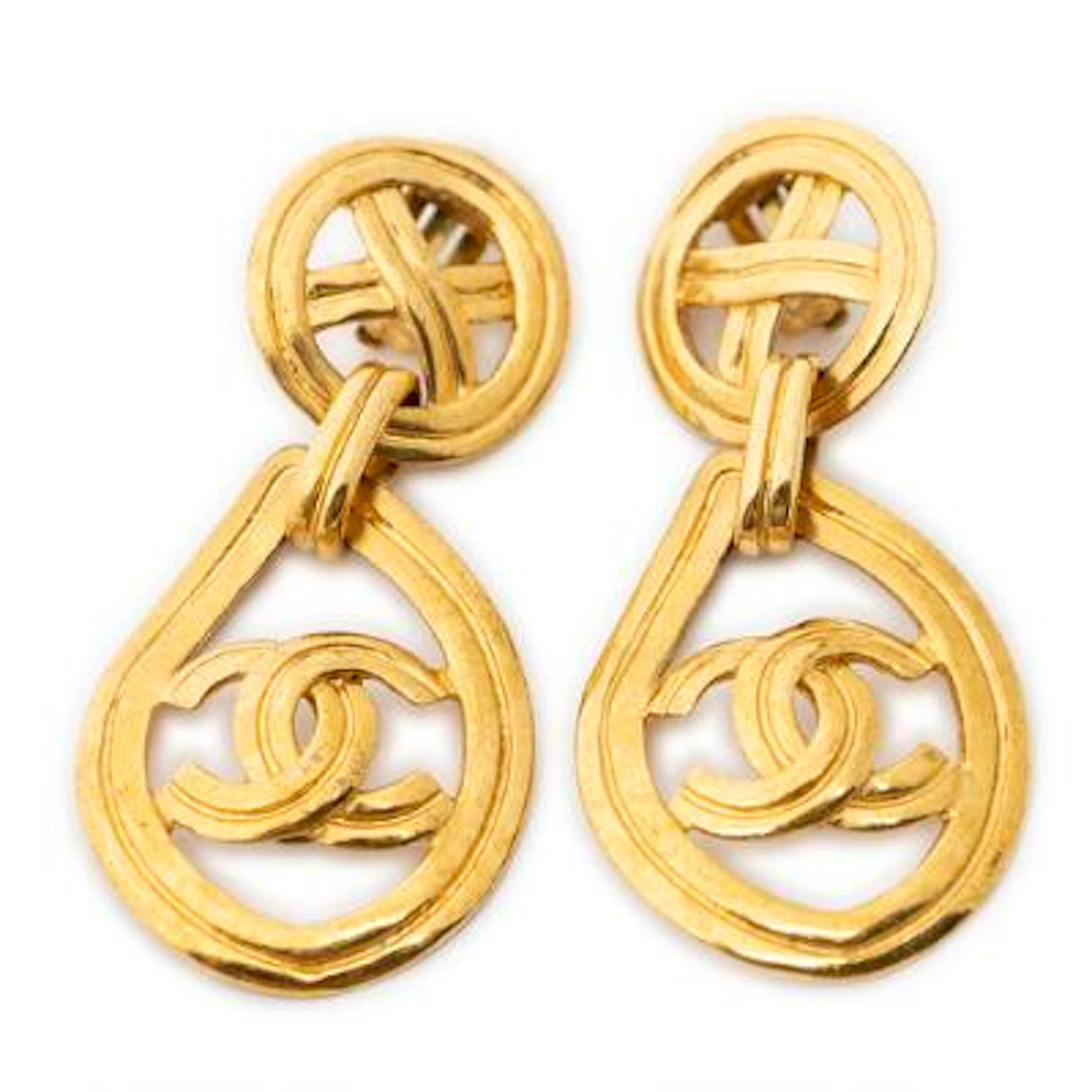 Chanel: A pair of ear clips of gold-toned metal each set with CC logo.