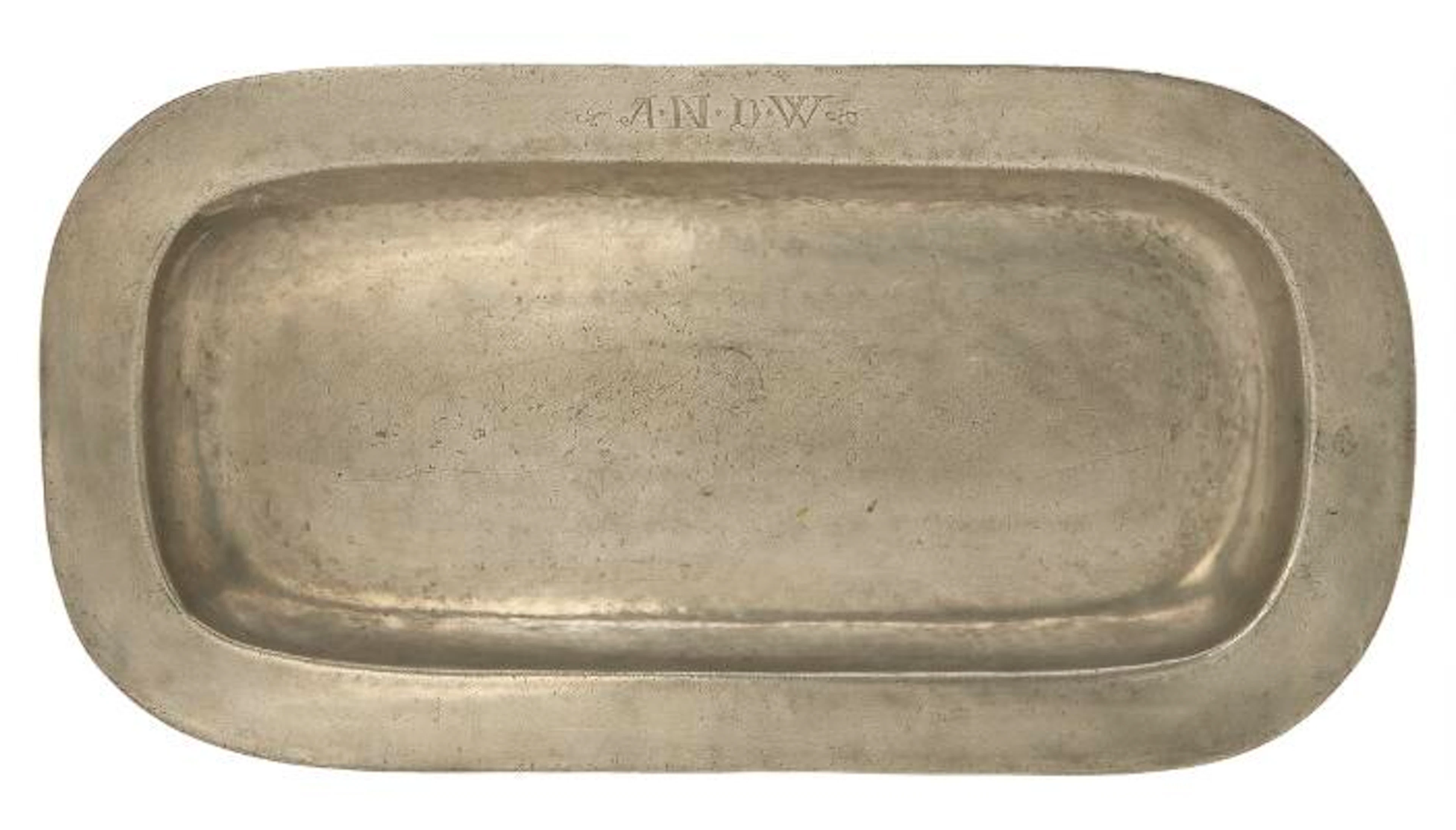 A large pewter dish of oval form. Engraved with owner initials. L.