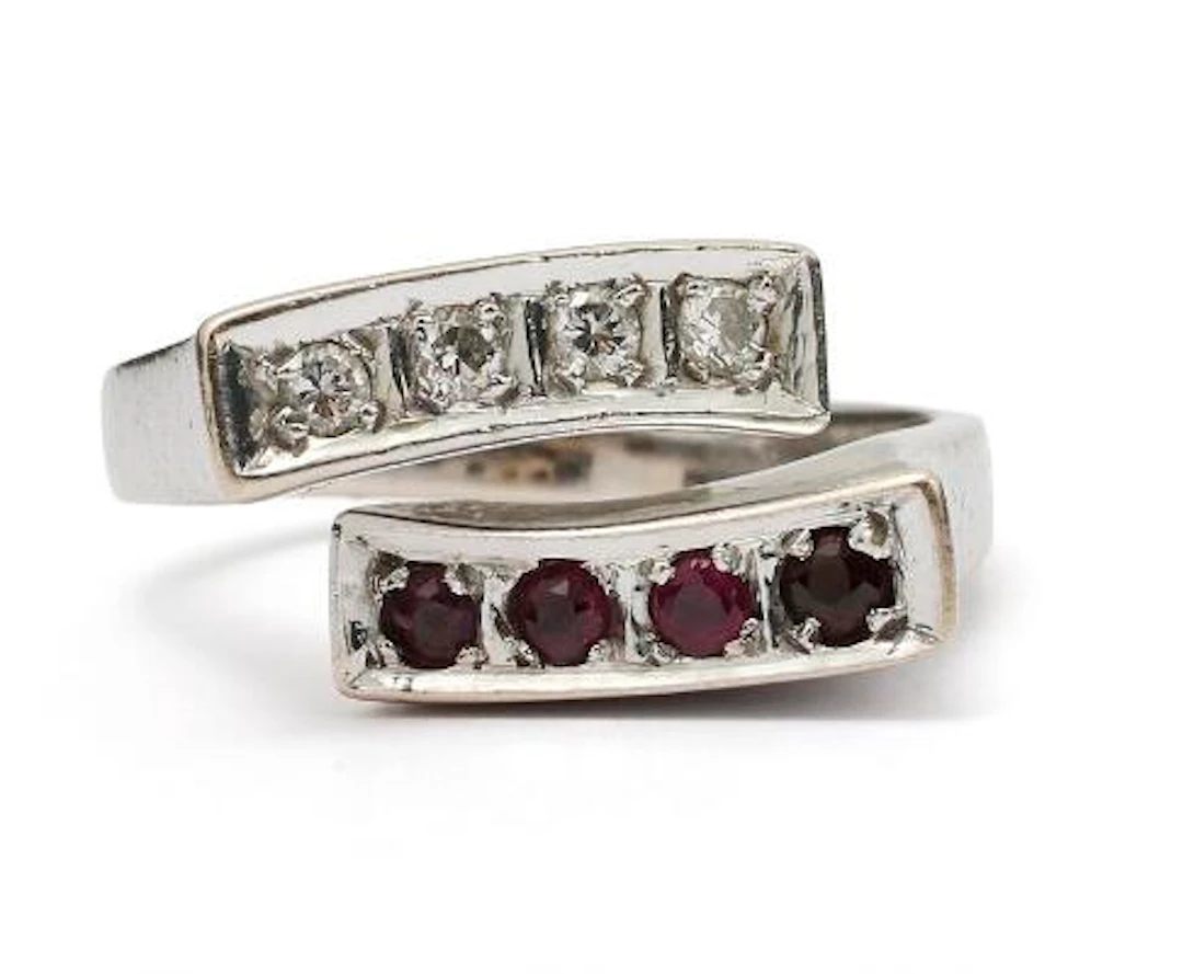 A ruby and diamond ring set with rubies and diamonds, mounted in 14k