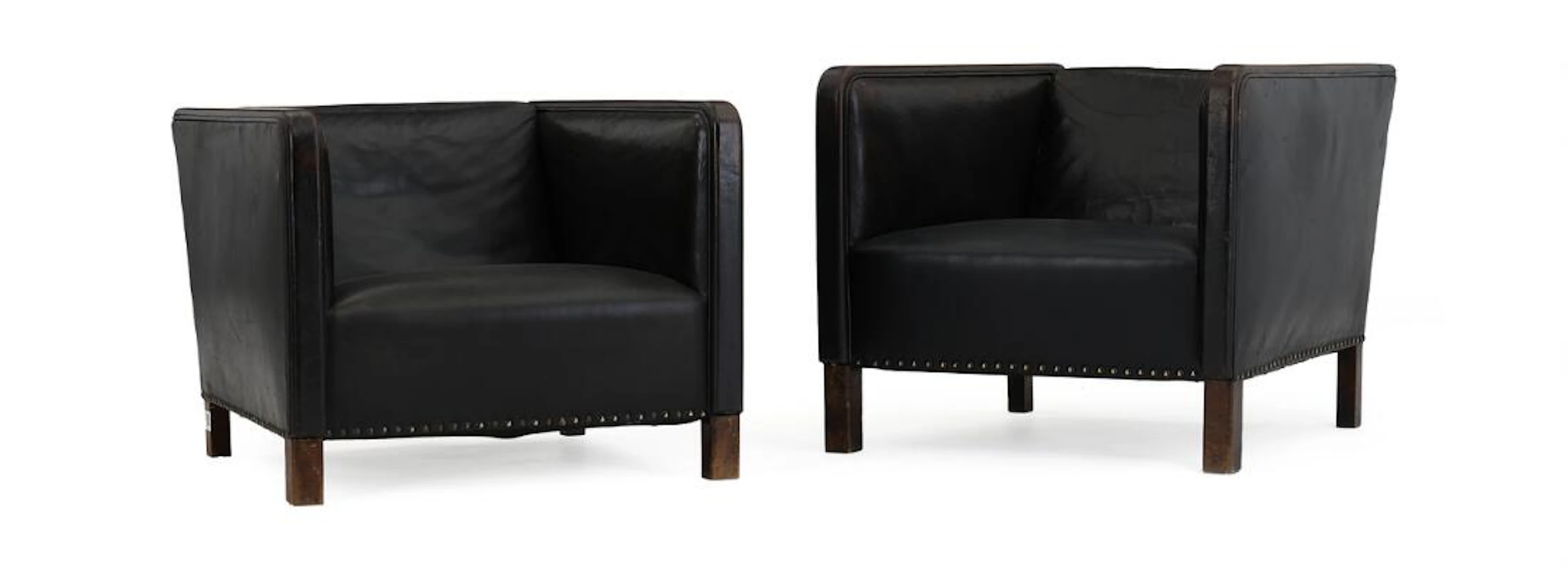 Unknown design: A pair of armchairs with legs of stained beech. Seat