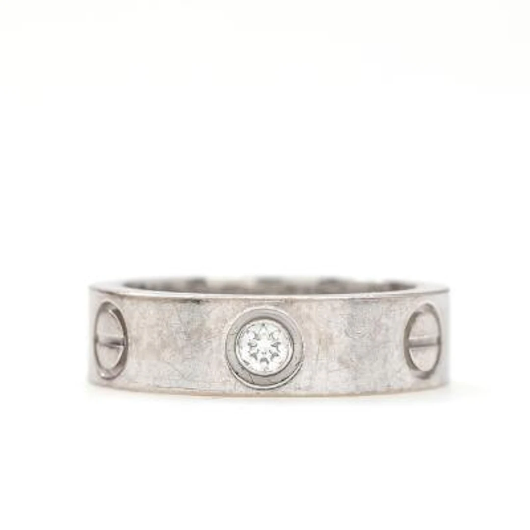 Cartier: A "Love" diamond ring of 18k white gold. Serial no. QZ2899.
