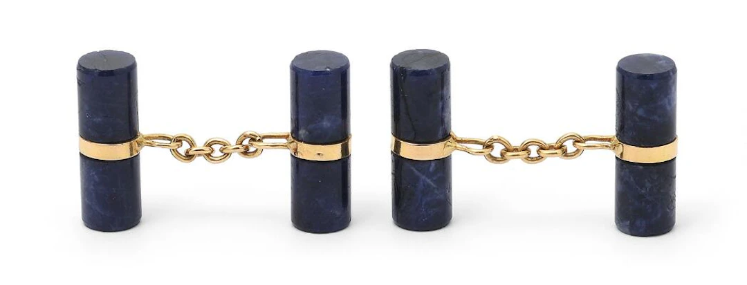 A pair of lapis lazuli cufflinks set with polished lapis lazuli mounted