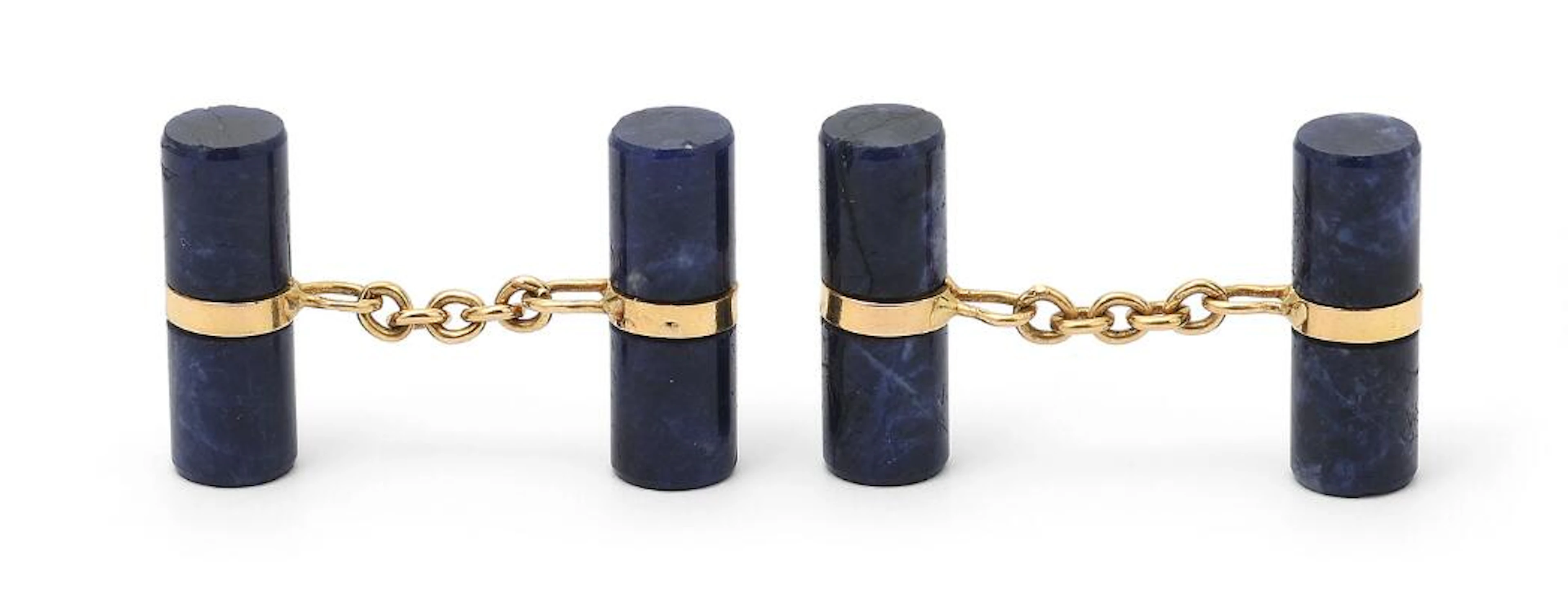 A pair of lapis lazuli cufflinks set with polished lapis lazuli mounted