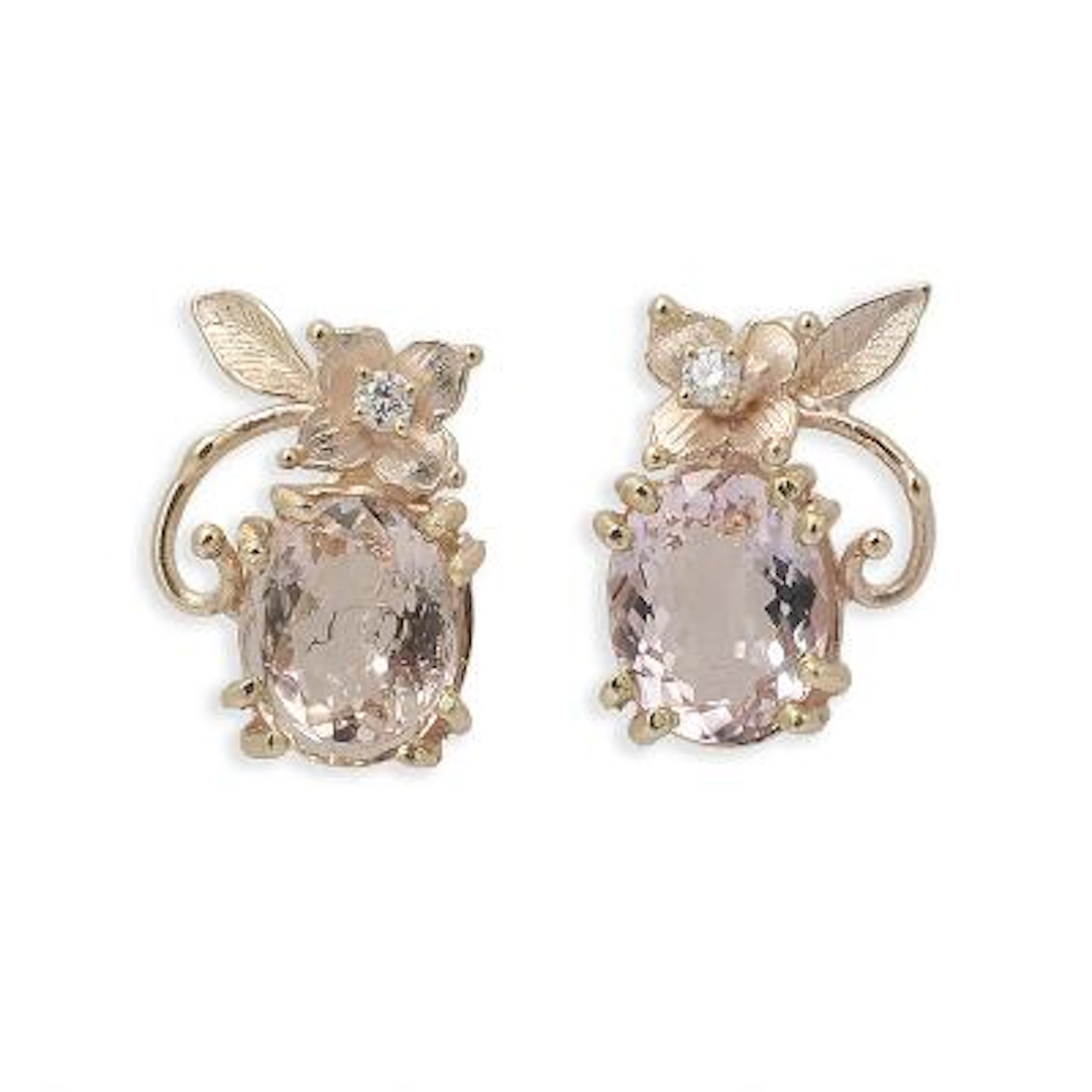 A pair of morganite and diamond ear studs each set with a morganite