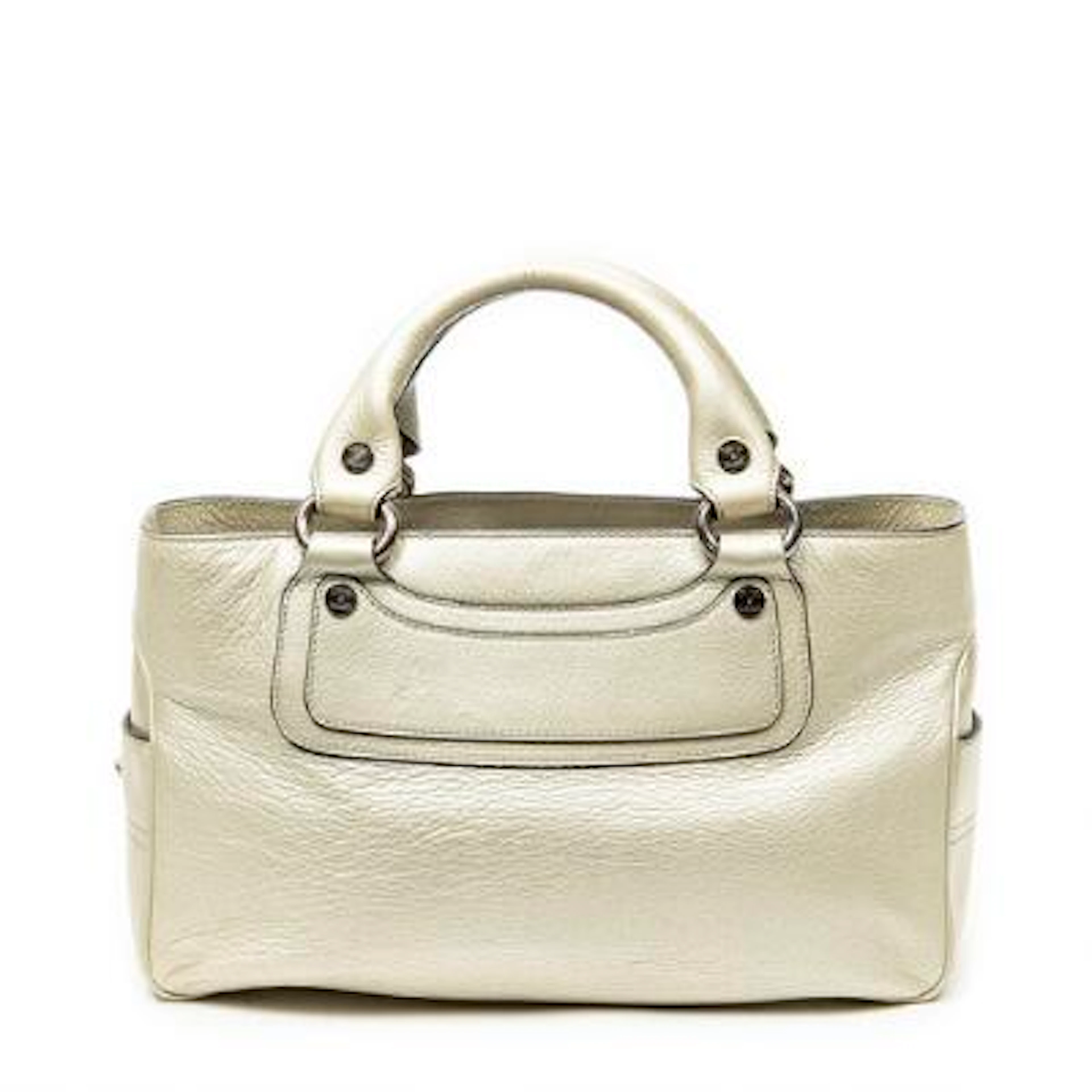 Celine: A "Boogie" bag in gold-tone leather with silver-tone hardware.