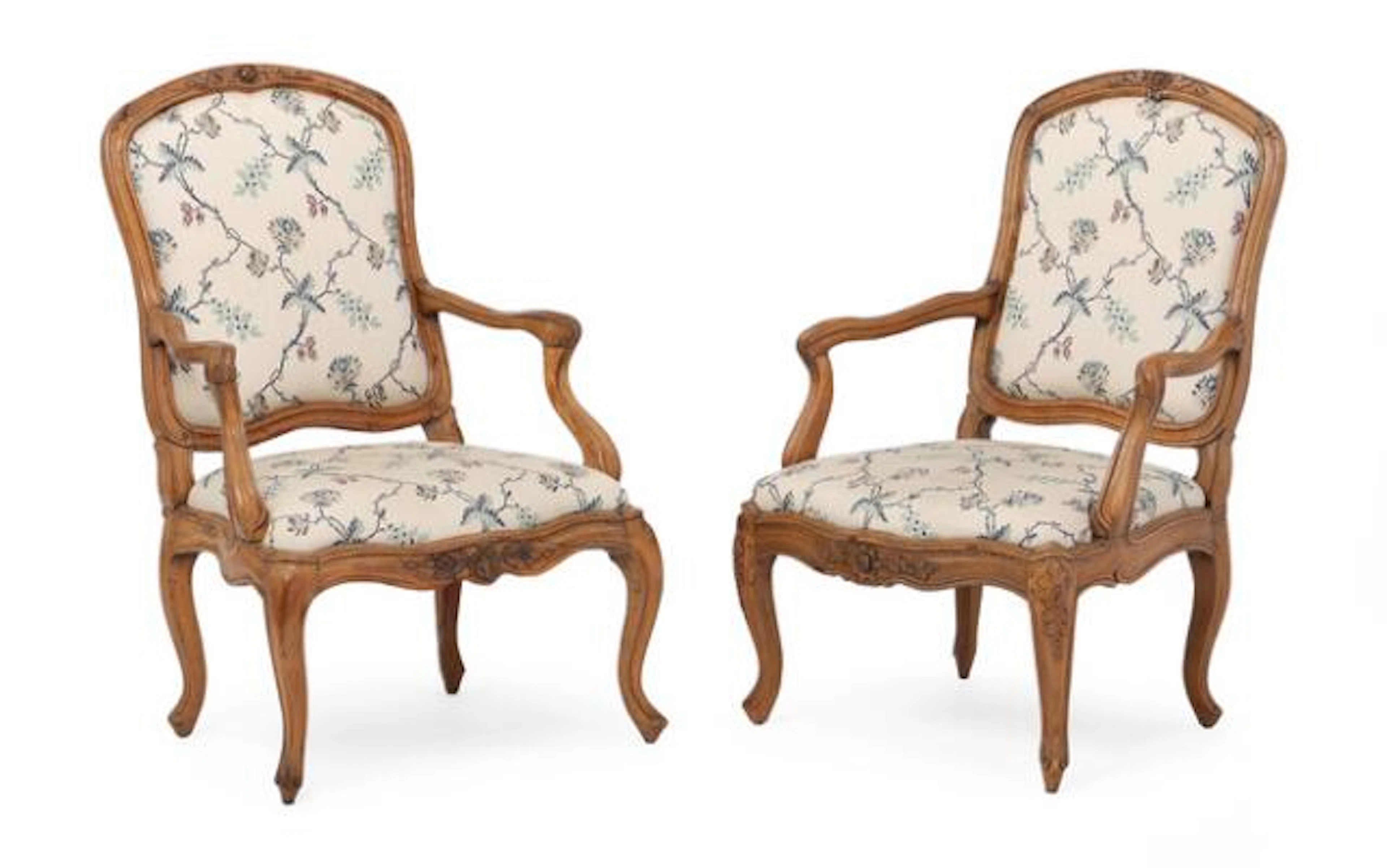 A pair of French rococo armchairs in walnut. Mid-18th century. (2)