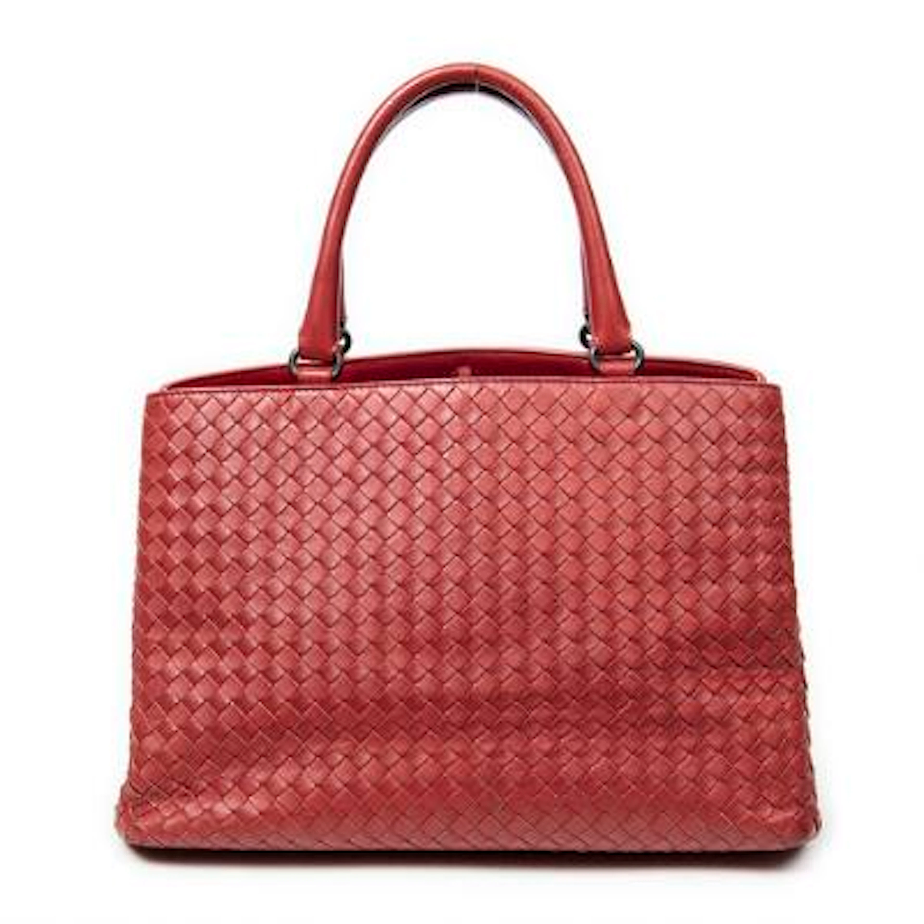 Bottega Veneta: A "Milano Tote" bag of red woven leather with silver