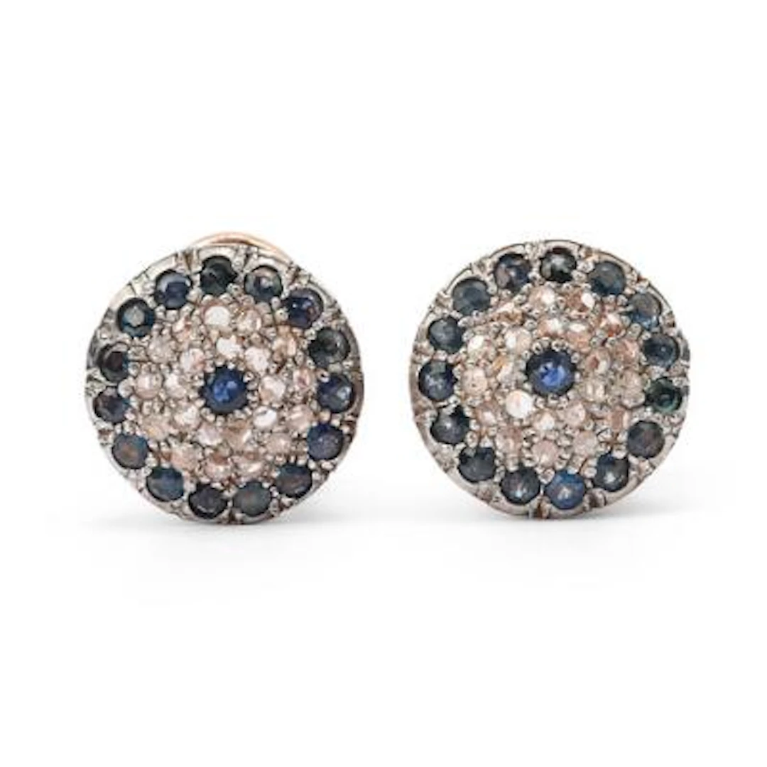 A pair of ear studs set with sapphires and diamonds, mounted in 9k