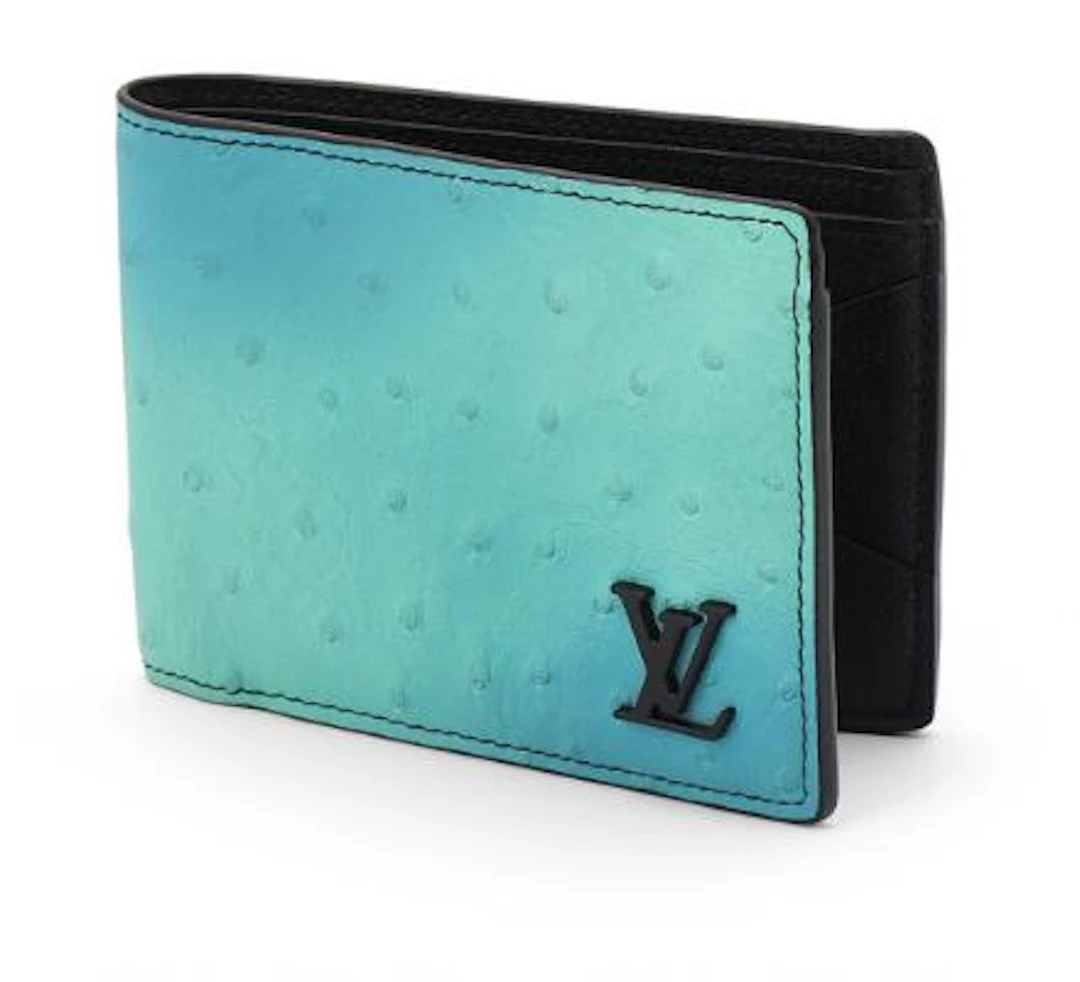 Louis Vuitton: A "Tropic Blue" fold over wallet of ombre blue ostrich