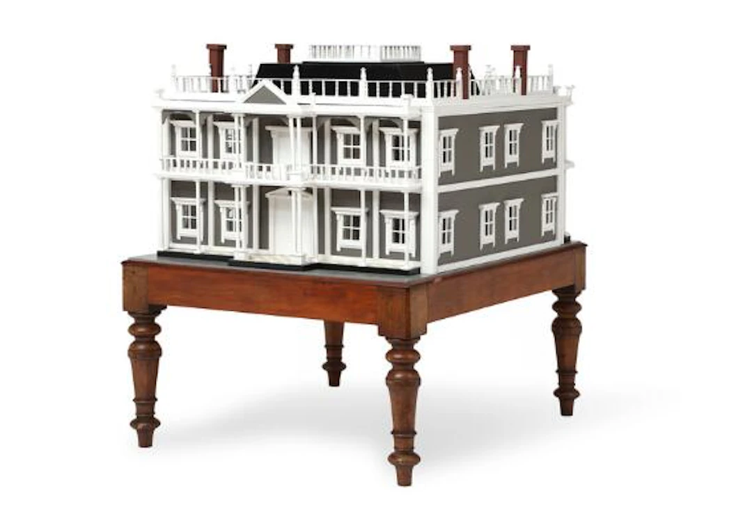 An English pale green and white painted wood dolls house. The house