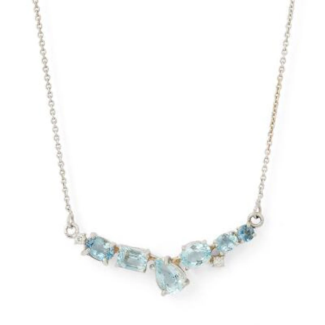 An aquamarine necklace set with aquamarines mounted in 14k white gold.