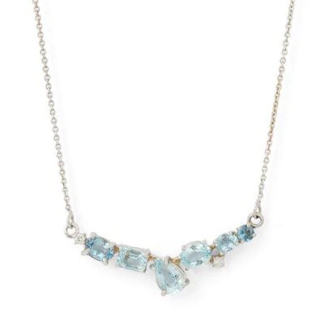 An aquamarine necklace set with aquamarines mounted in 14k white gold.