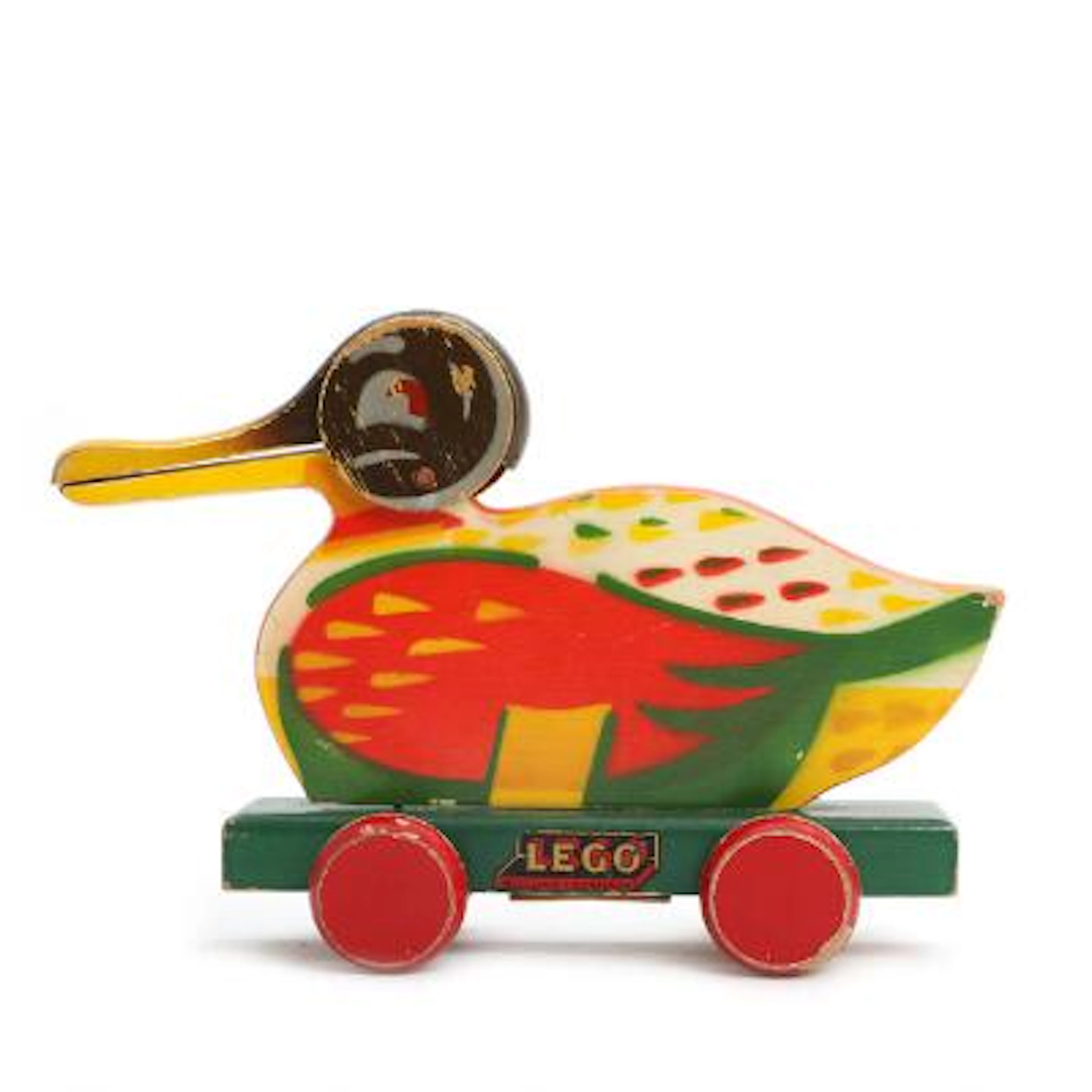 LEGO: A paint wooden pull duck on wheels, marked “Lego, Billund Denmark”.