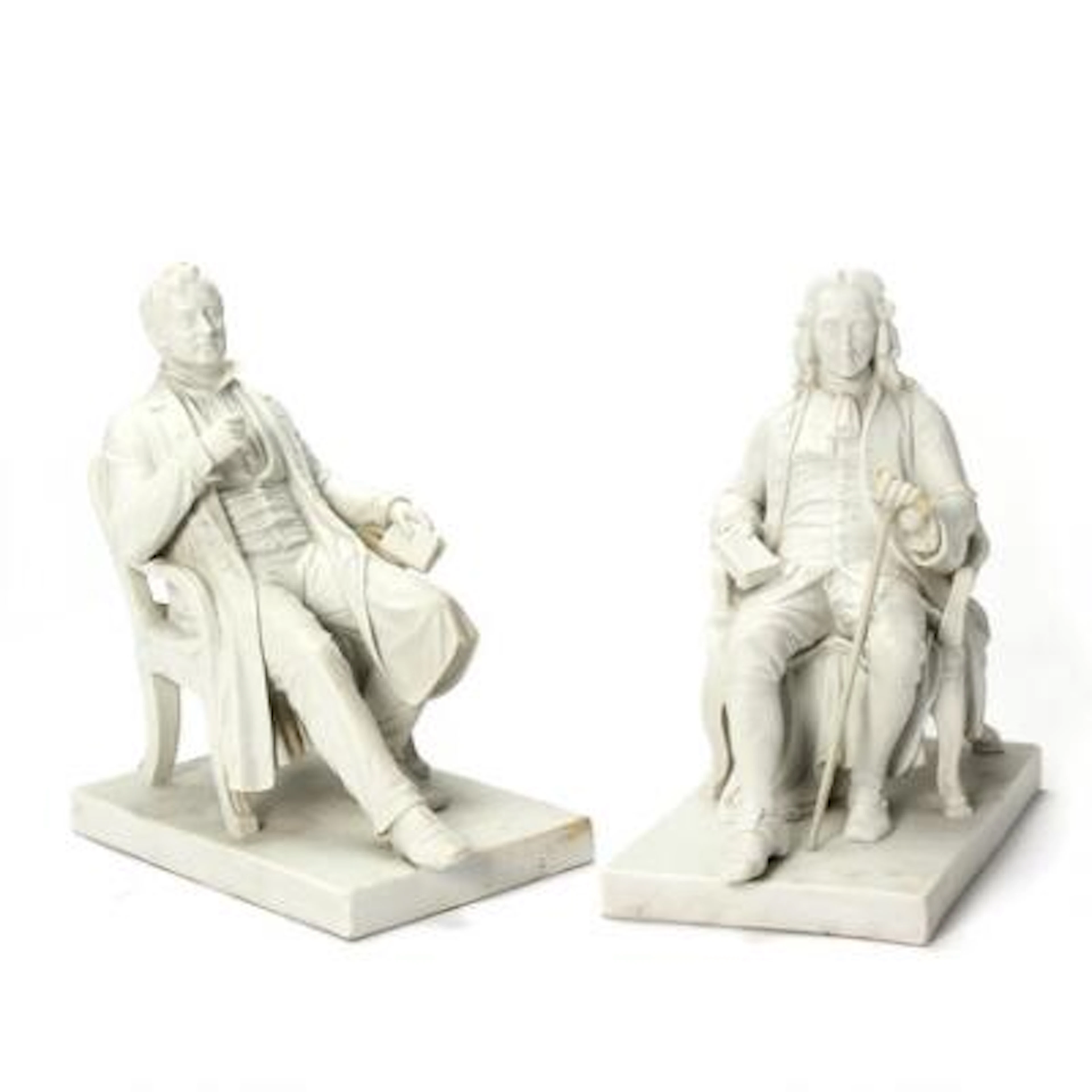 A pair of biscuit figurines depicting Ludvig Holberg and Adam Oehlenschläger.