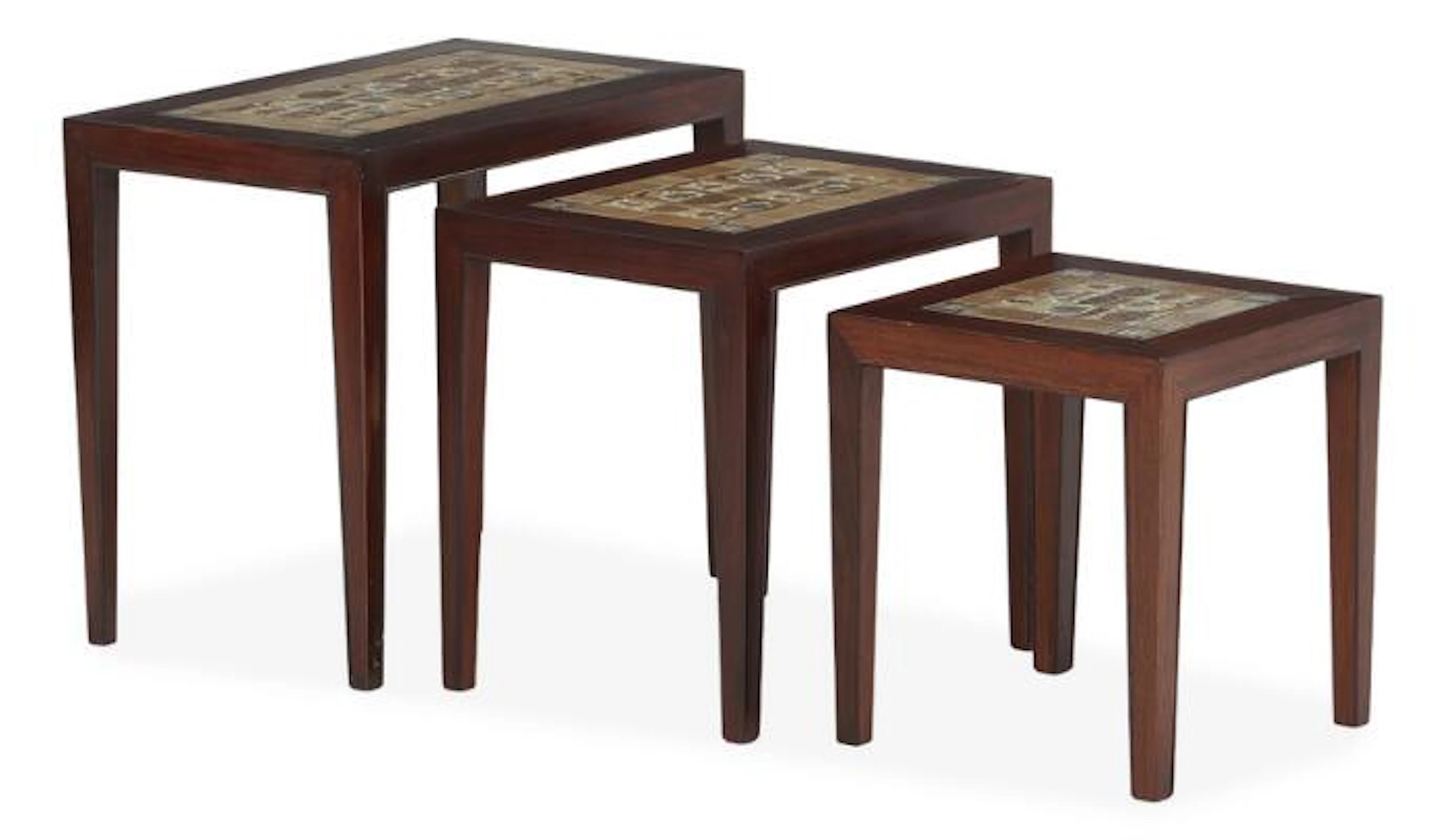 Severin Hansen Jr.: A set of three rosewood nesting tables with faience