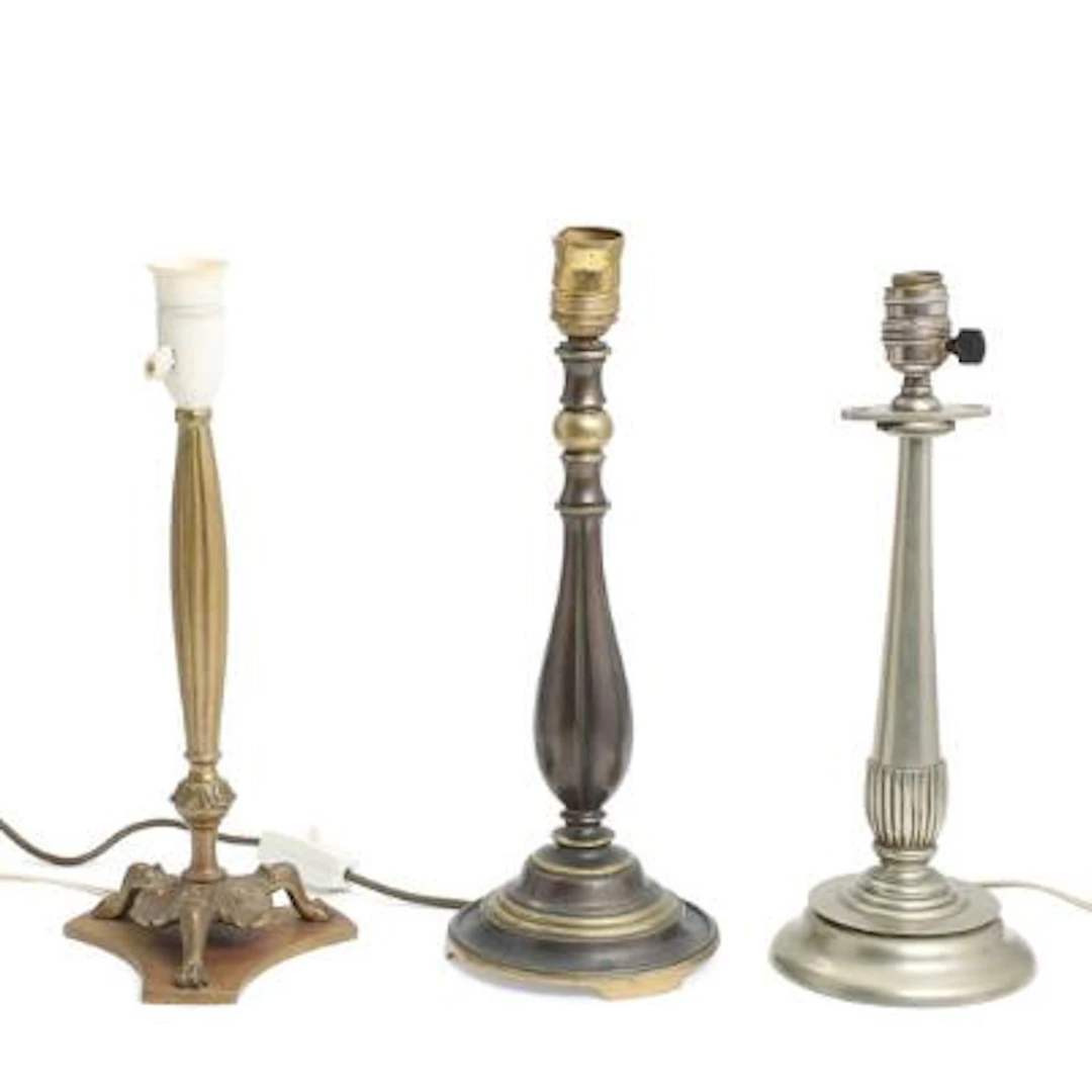 Three table lamps of partially patinated and tinned bronze. Early