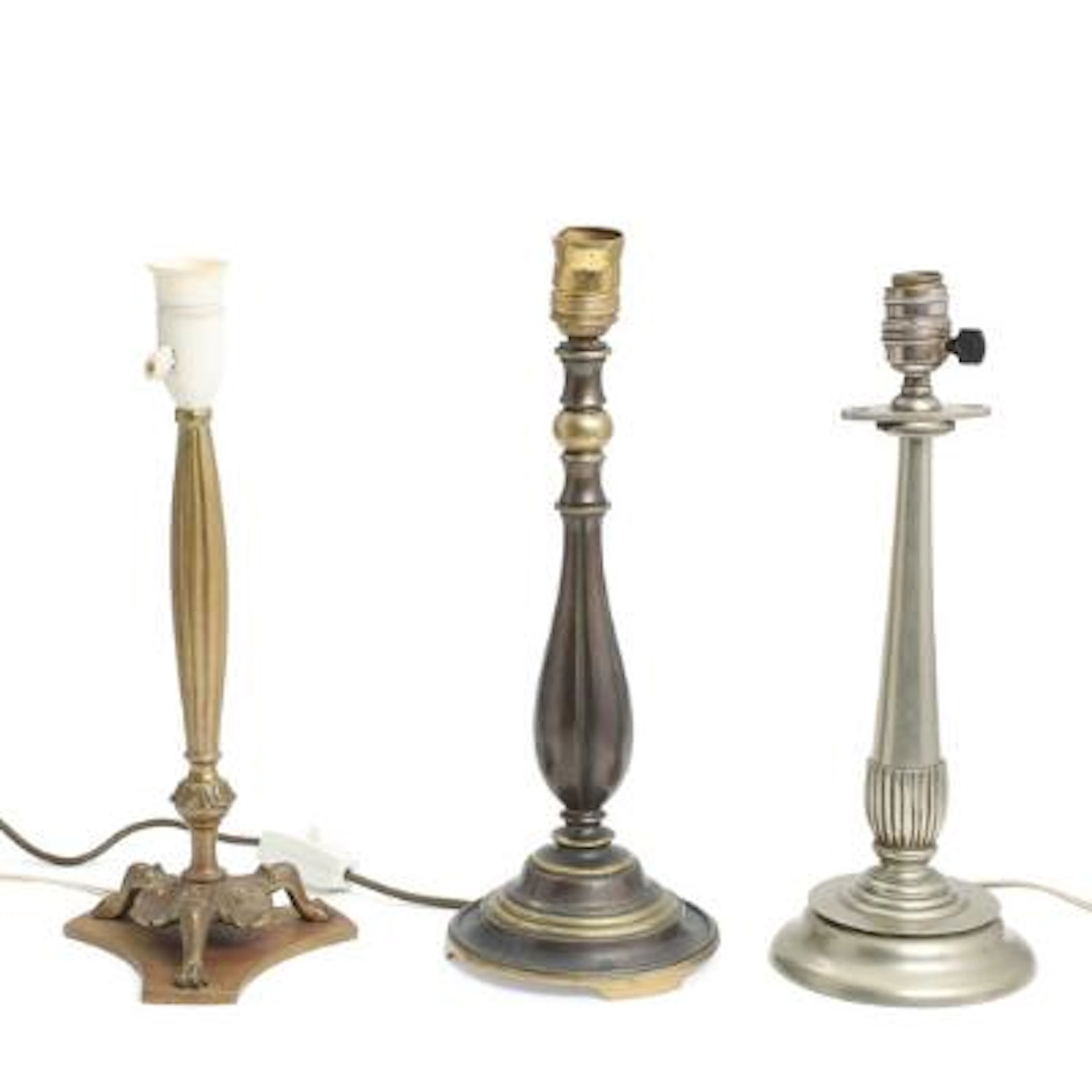 Three table lamps of partially patinated and tinned bronze. Early