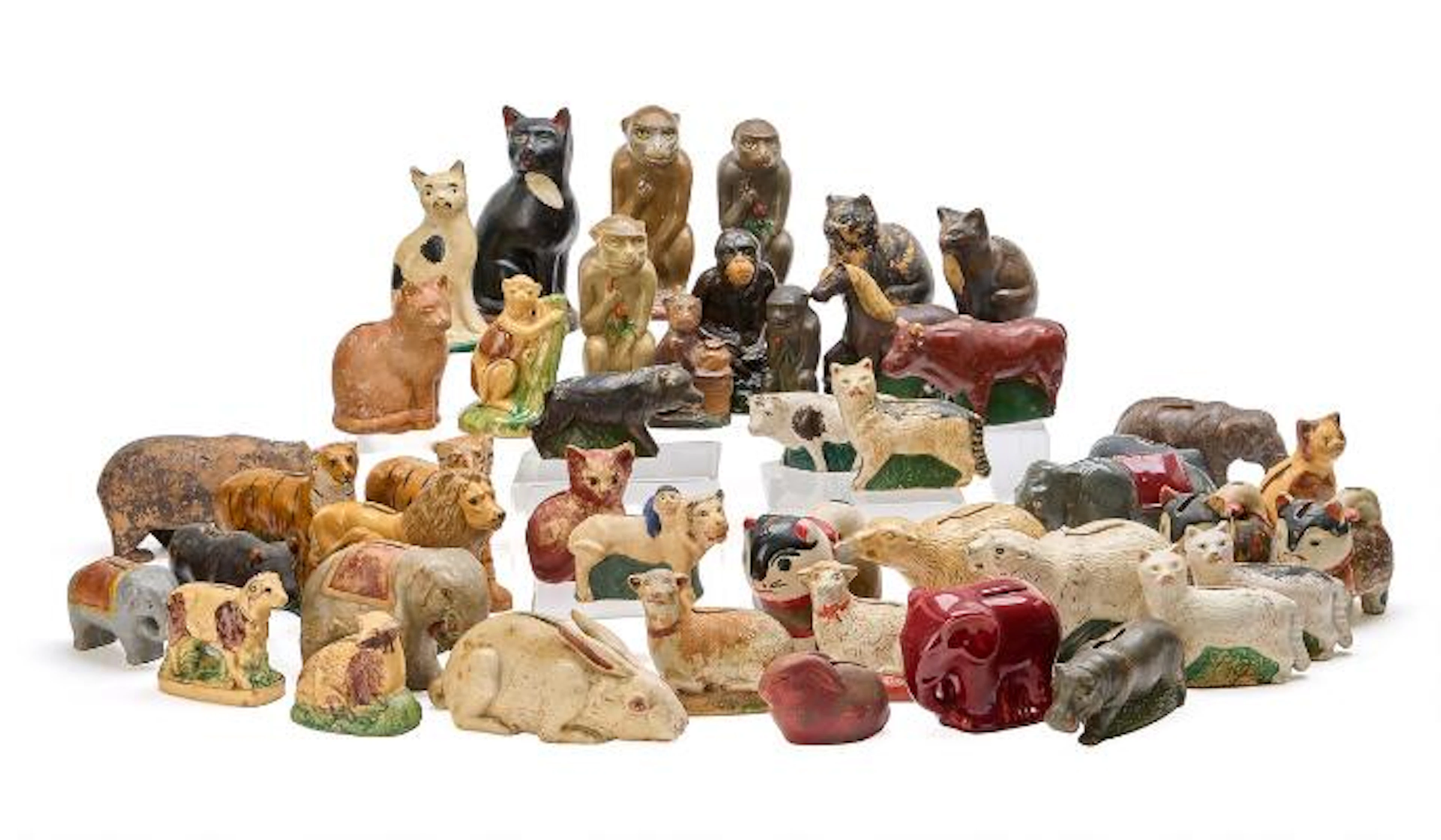 A collection of money boxes in the form of various animals. Primarily
