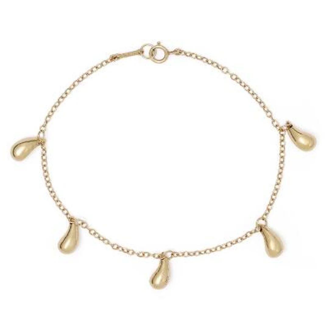 Tiffany & Co.: A "Teardrop" bracelet of 18k gold set with five charms.