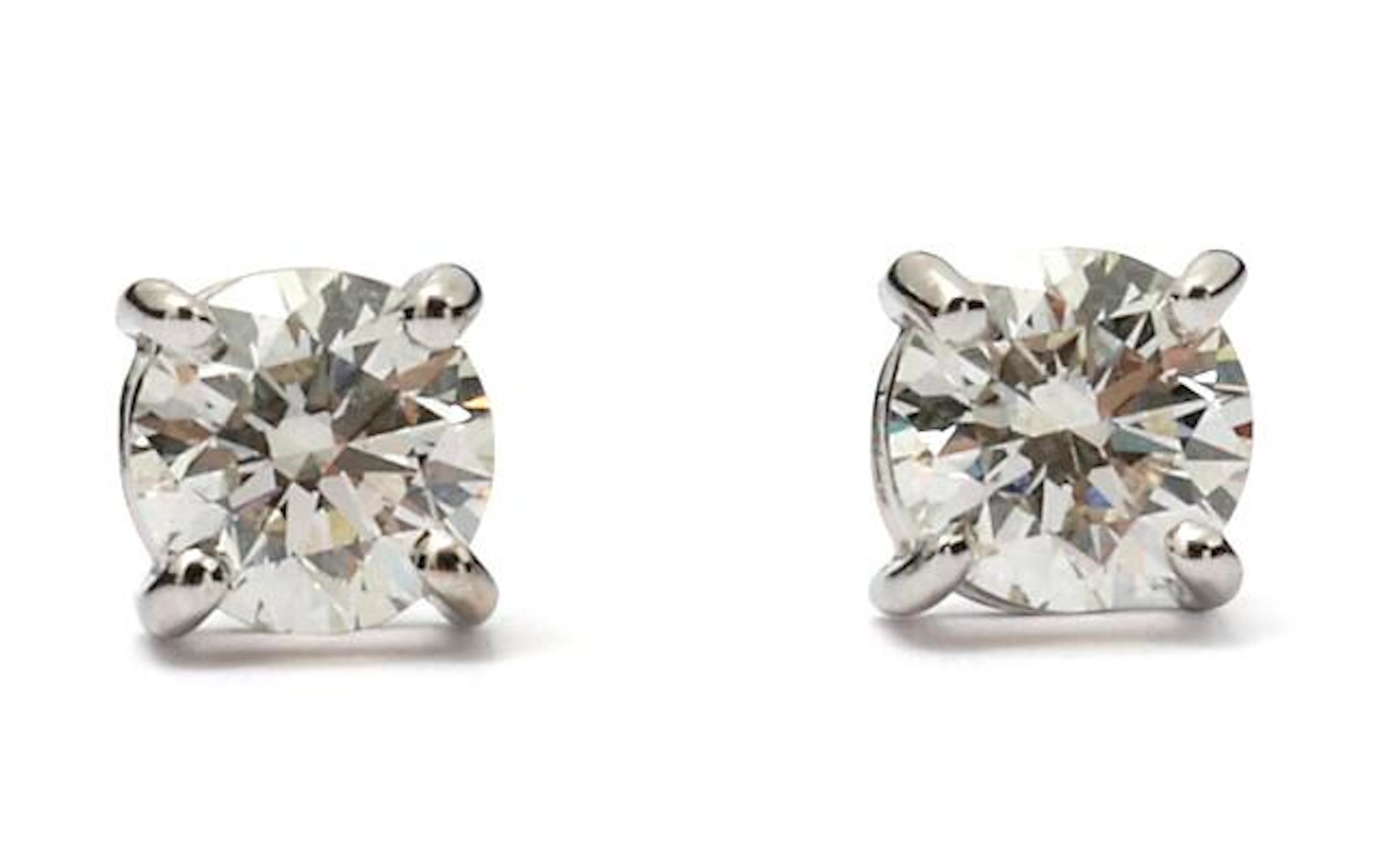 A pair of diamond ear studs each set with a brilliant-cut diamond