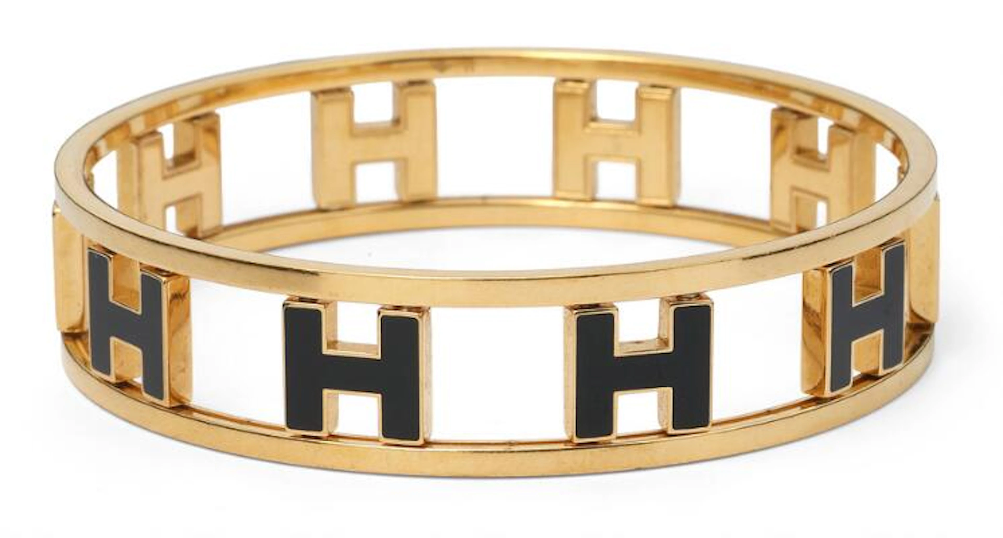 Hermès: A "Rondo Ash H" bangle set with gold-toned metal with an "H"