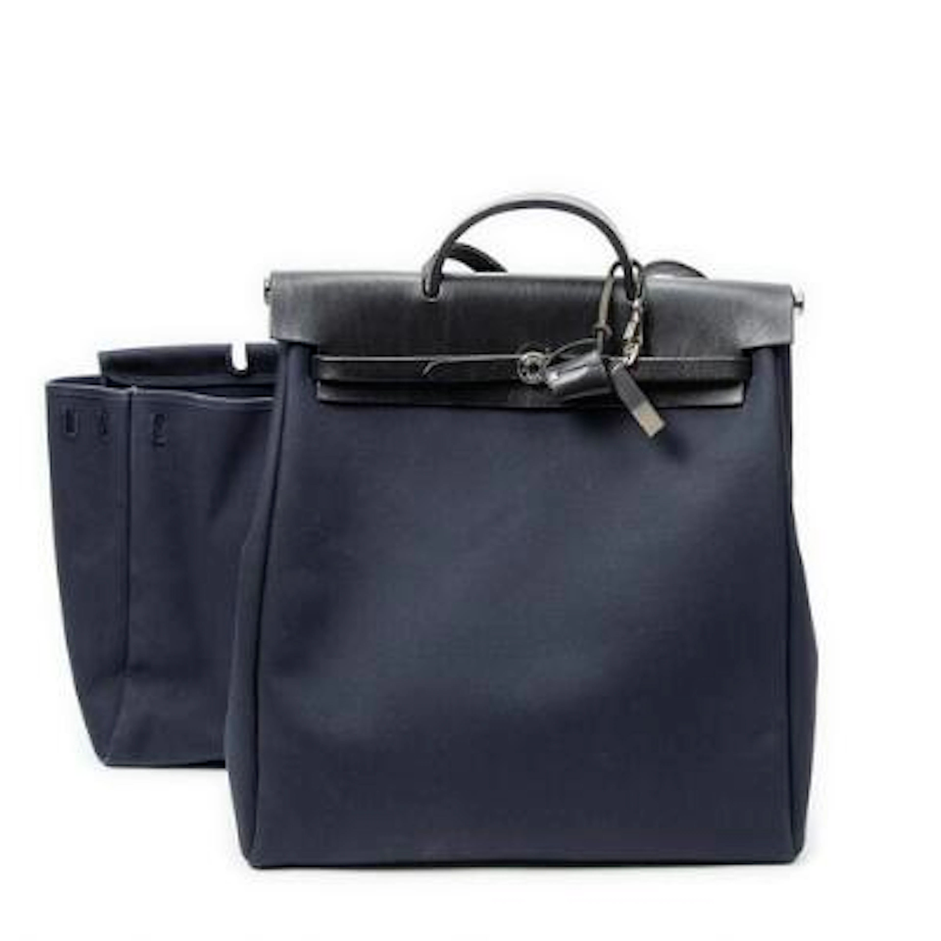 Hermès: A "Herbag GM" in partially navy blue Toile Officier-canvas