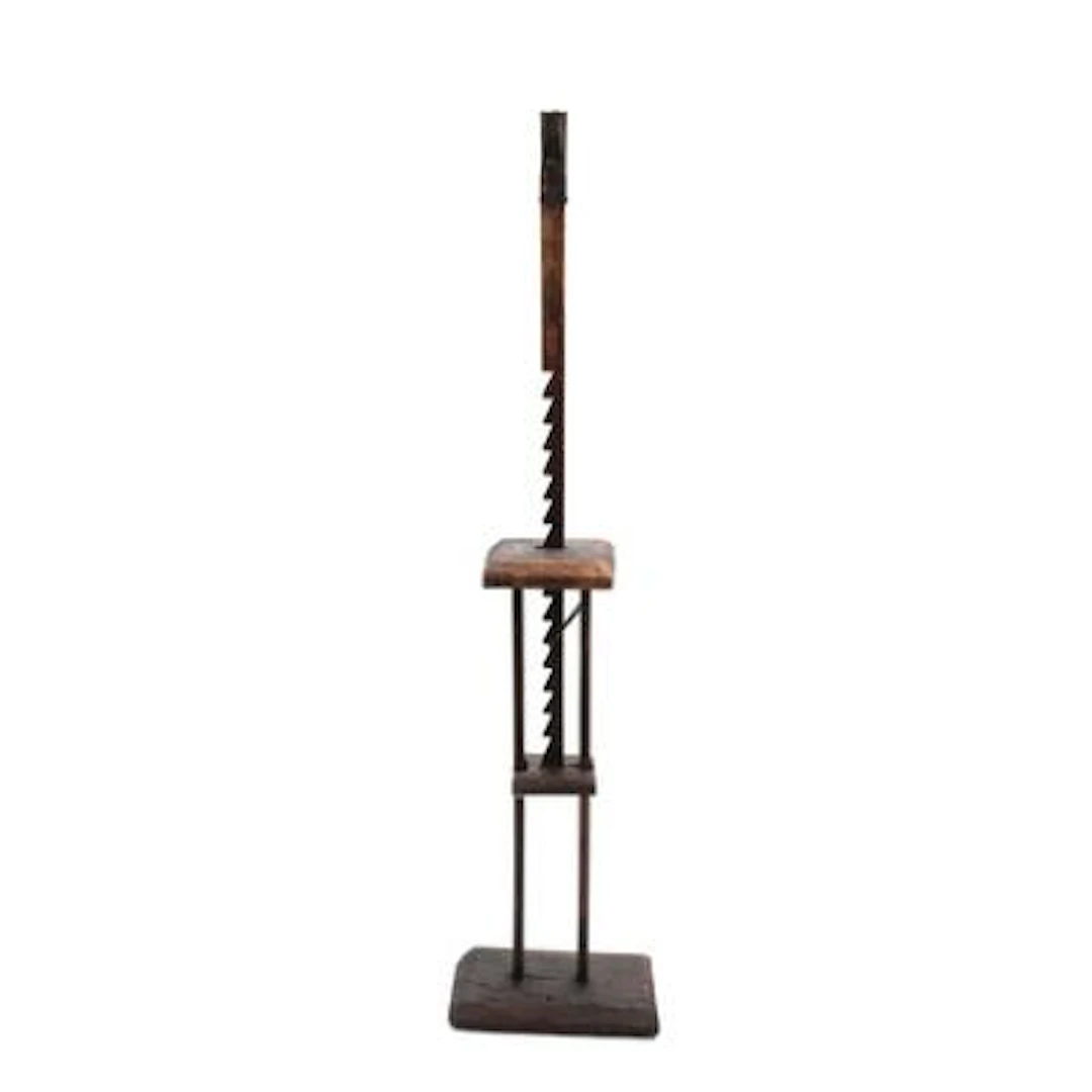 A height adjustable wood and iron floor candlestick. 18th-19th century.
