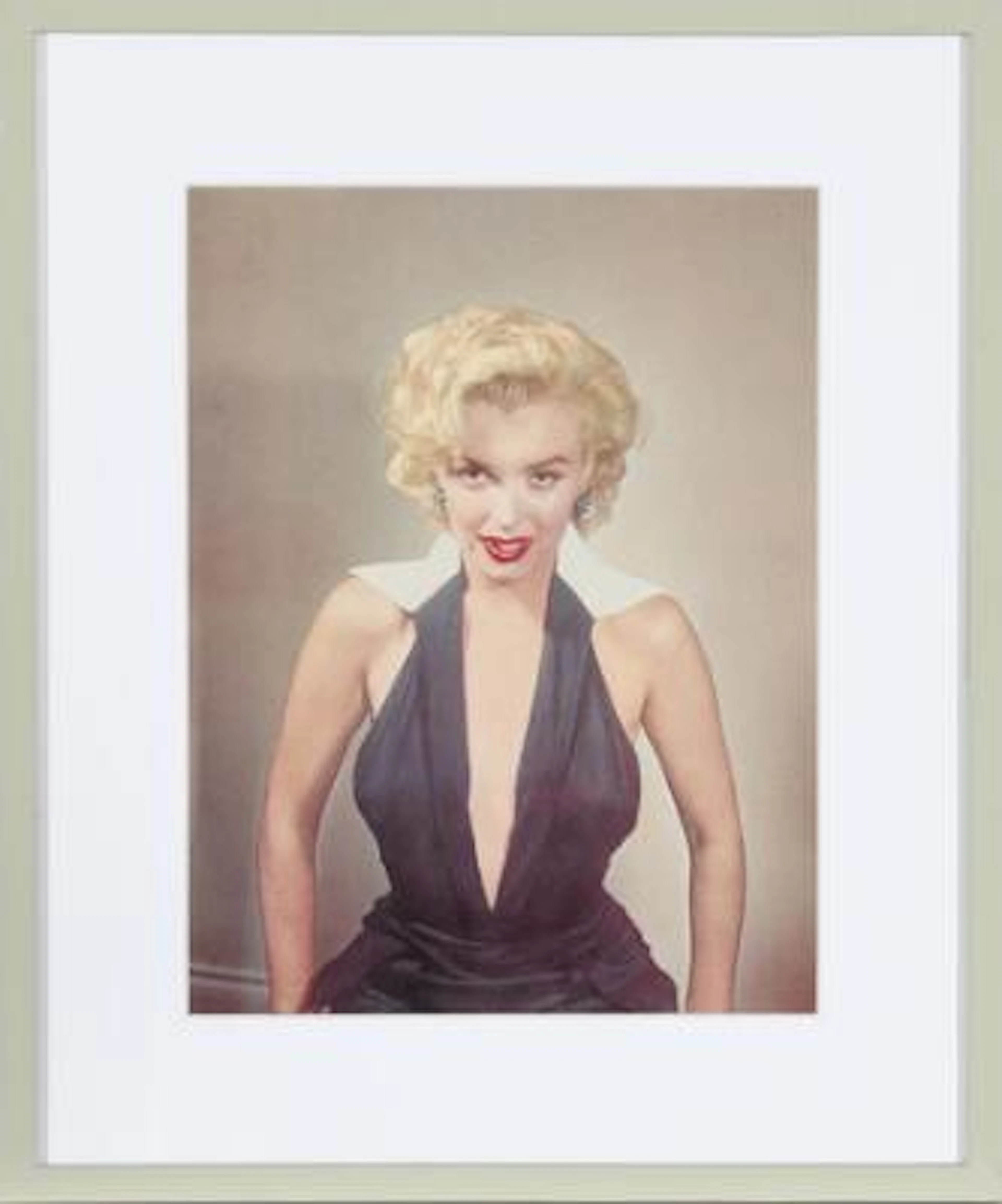American actress Marilyn Monroe (1926–1962) wearing a low-cut blue