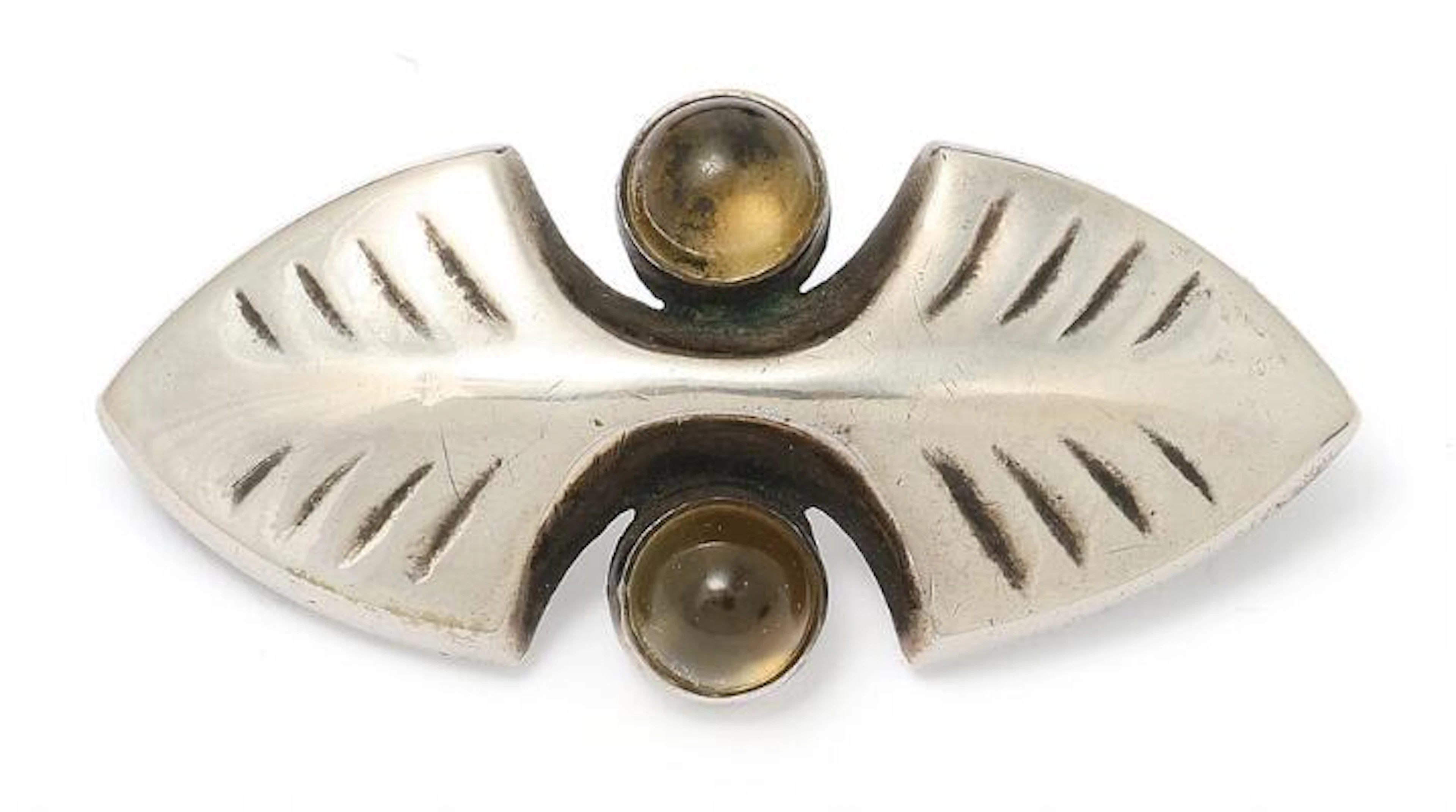 Mogens Ballin: A citrine brooch set with two cabochon citrines, mounted