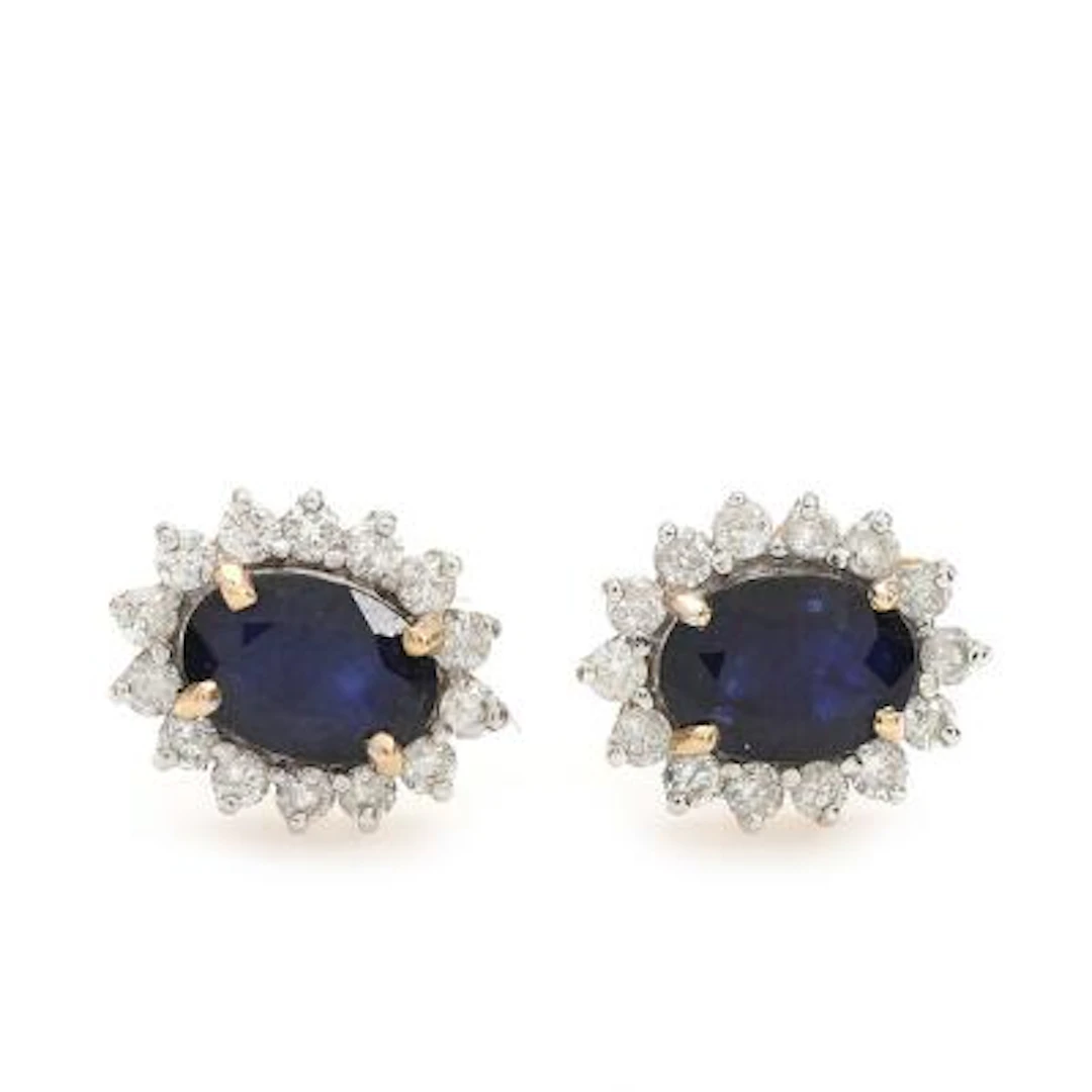 A pair of sapphire and diamond ear rings each set with faceted sapphire