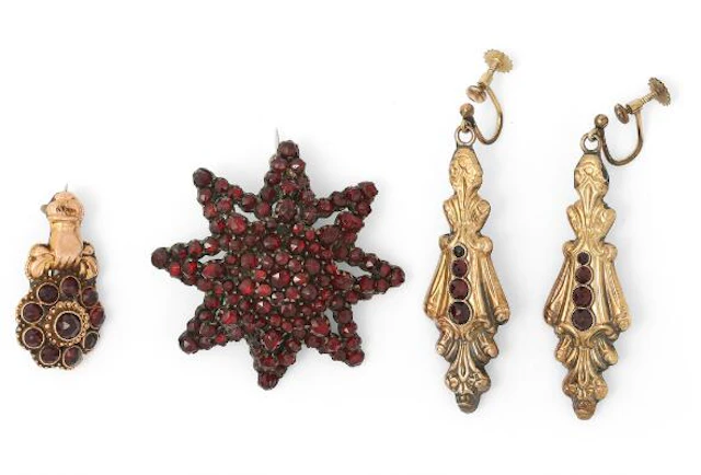 A jewellery collection comprising of two brooches and a pair of ear