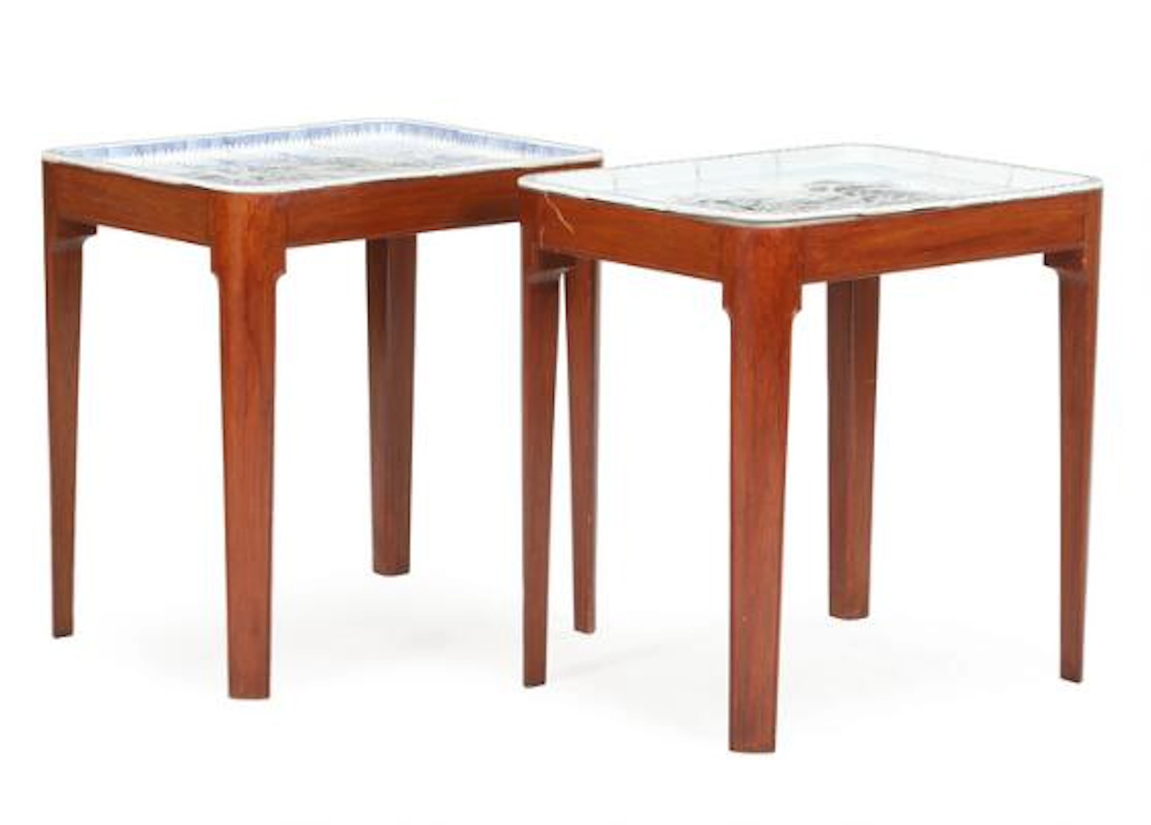 A pair of mahogany tables, top with porcelain tiles. B&G. 20th century.