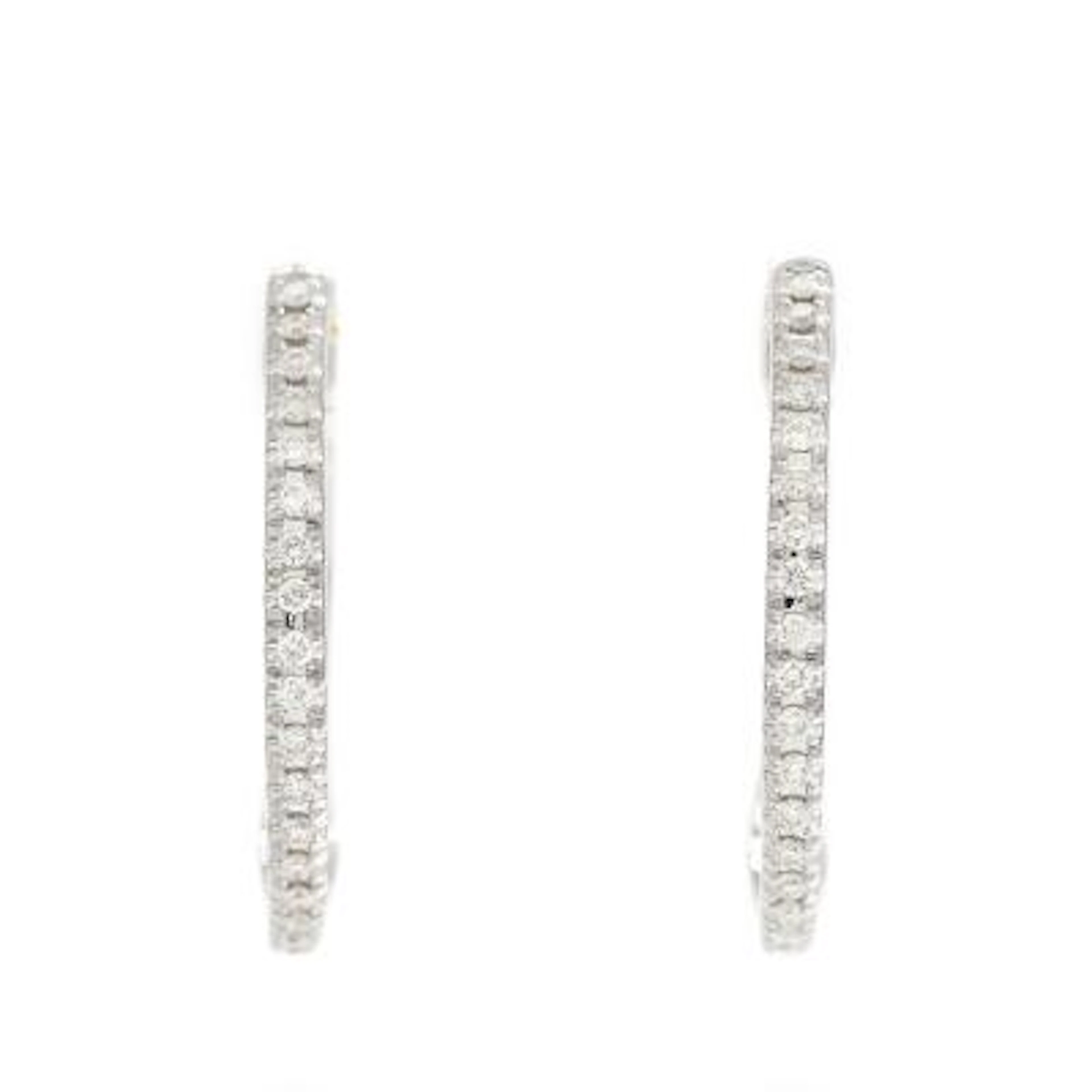 A pair of diamond ear hoops, each set with numerous brilliant-cut
