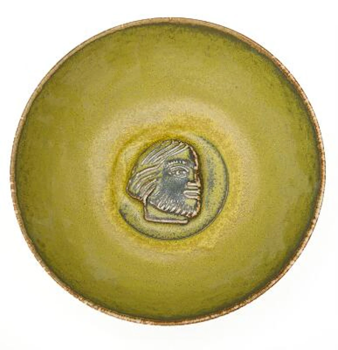 Jais Nielsen: A circular stoneware bowl decorated with solfatara glaze.