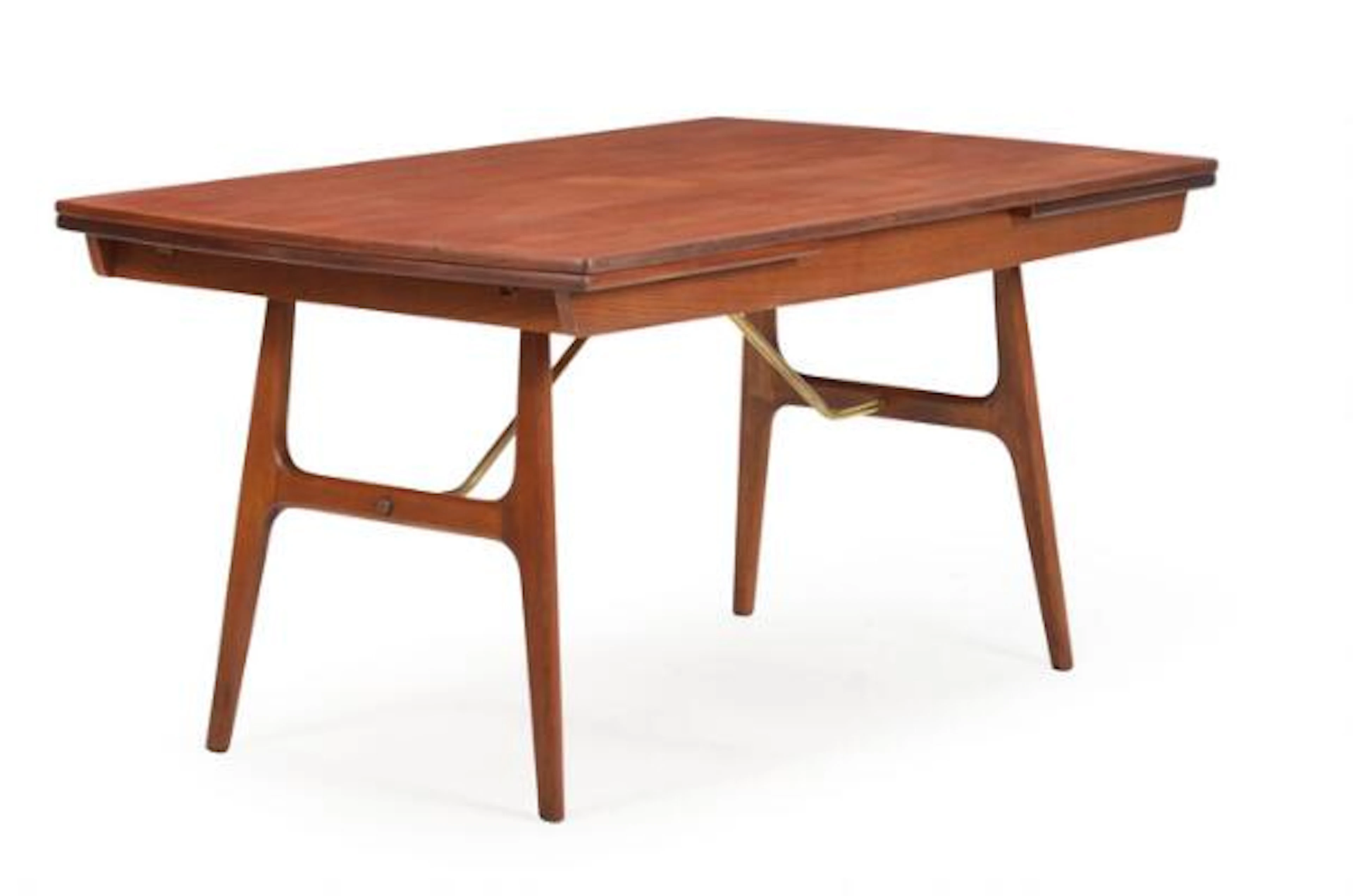Danish furniture design: A dining table with oak frame, brass stretchers