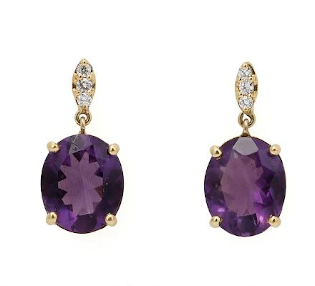 A pair of amethyst and diamond ear pendants each set with an amethyst