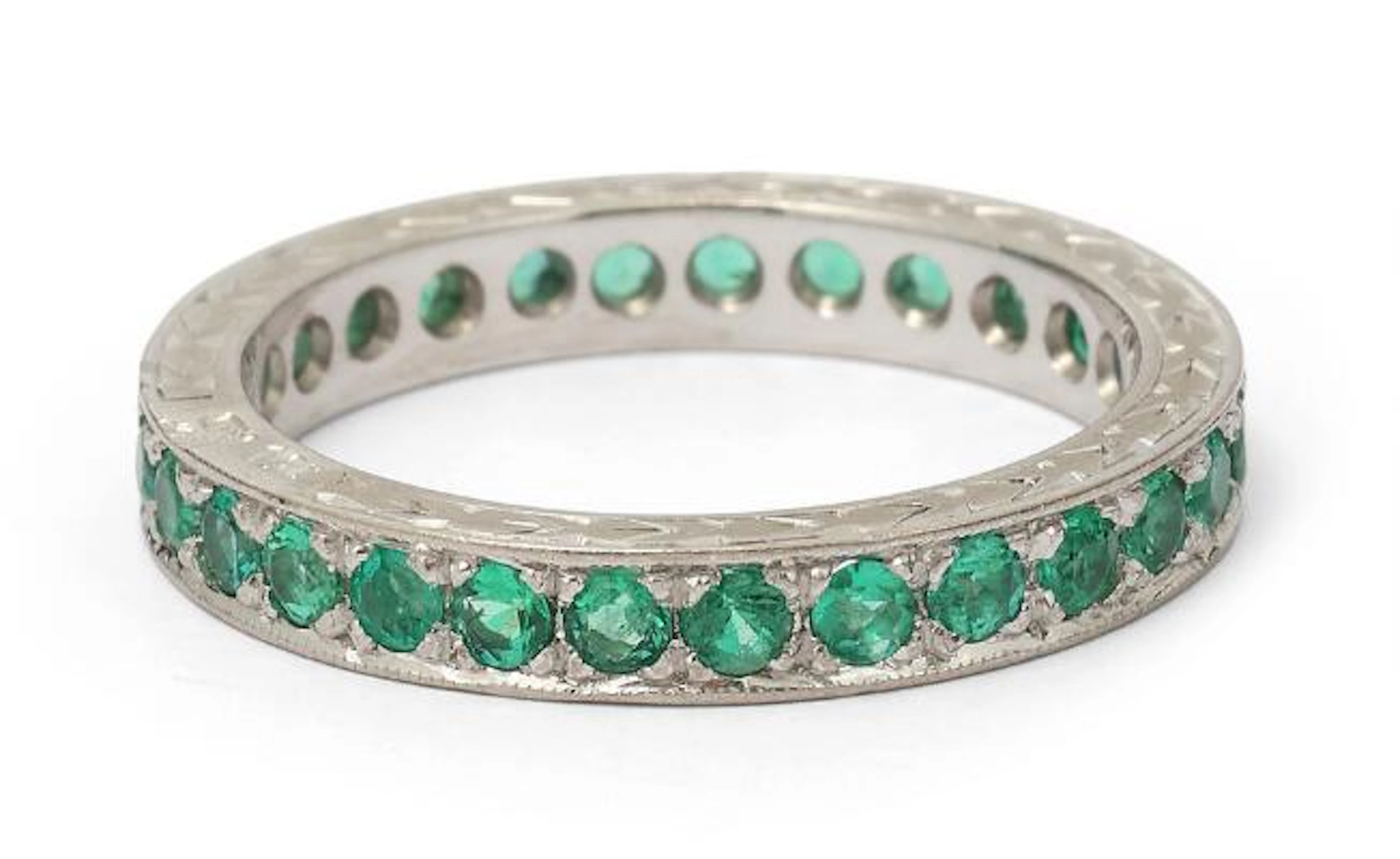 A. Dragsted: An emerald ring set with numerous emeralds mounted in