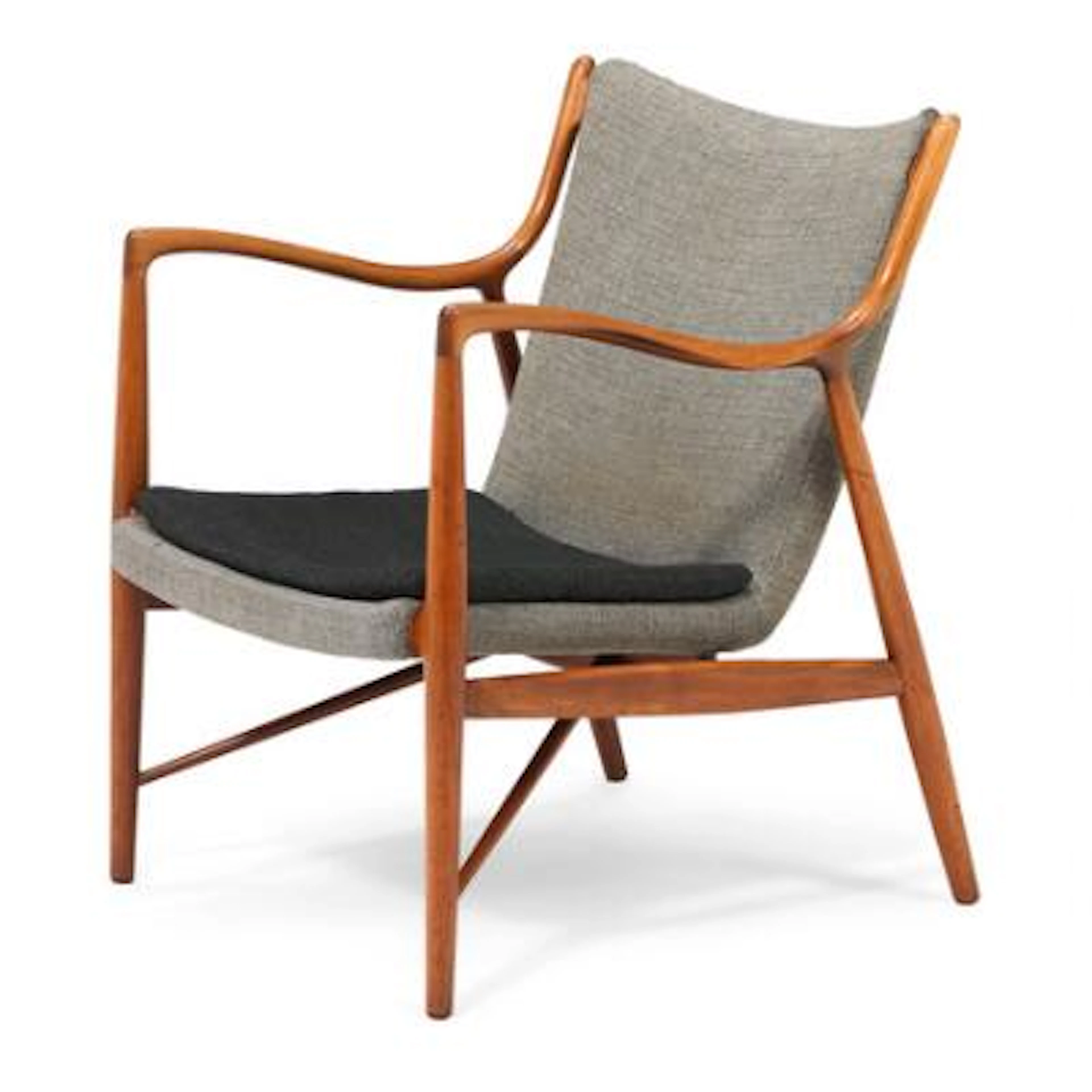 Finn Juhl: “FJ 45”. An early nutwood easy chair. Upholstered with