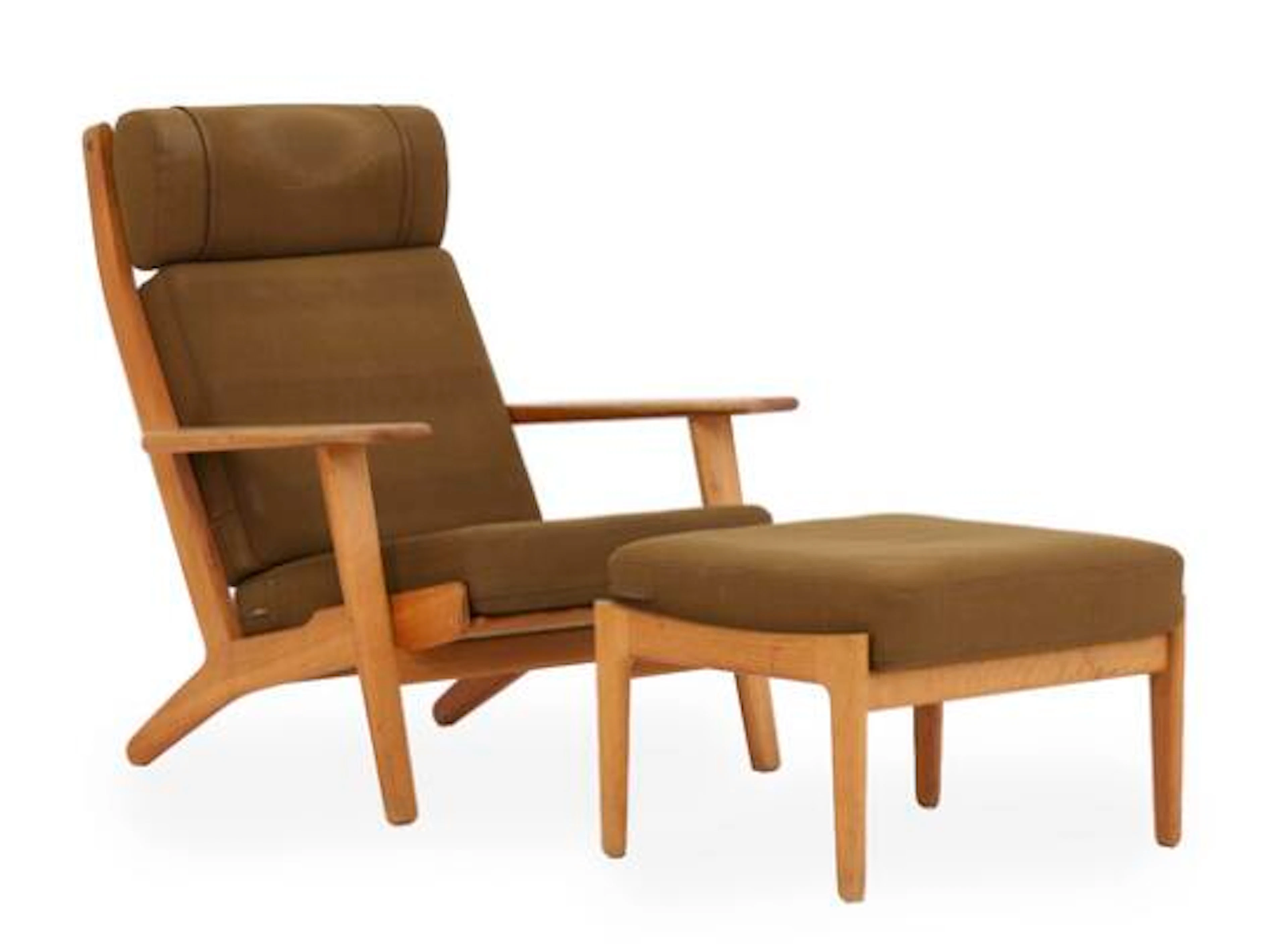 Hans J. Wegner: “GE 290”. High-backed easy chair and stool of oak.
