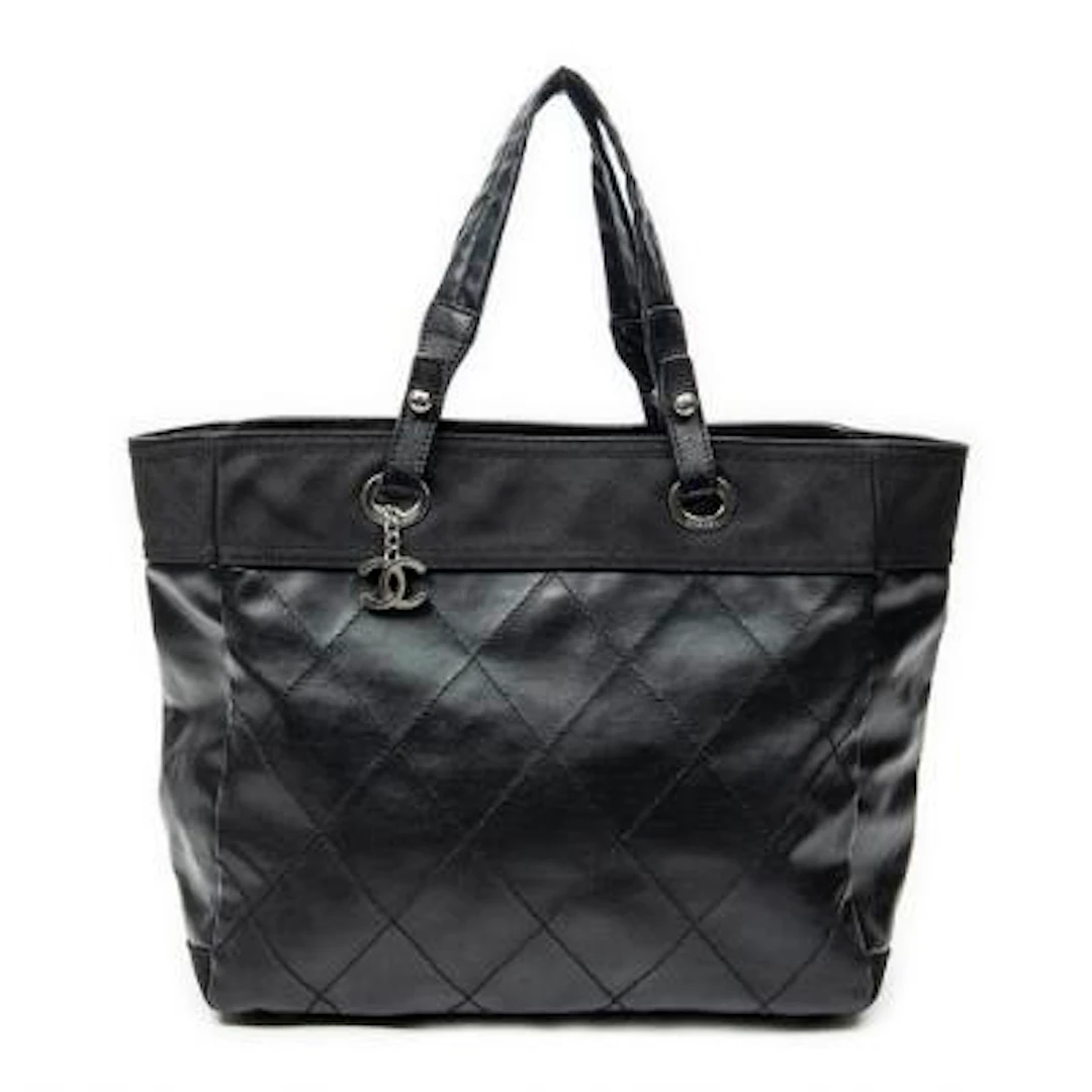 Chanel: A tote-bag of partly black quilted leather and canvas with
