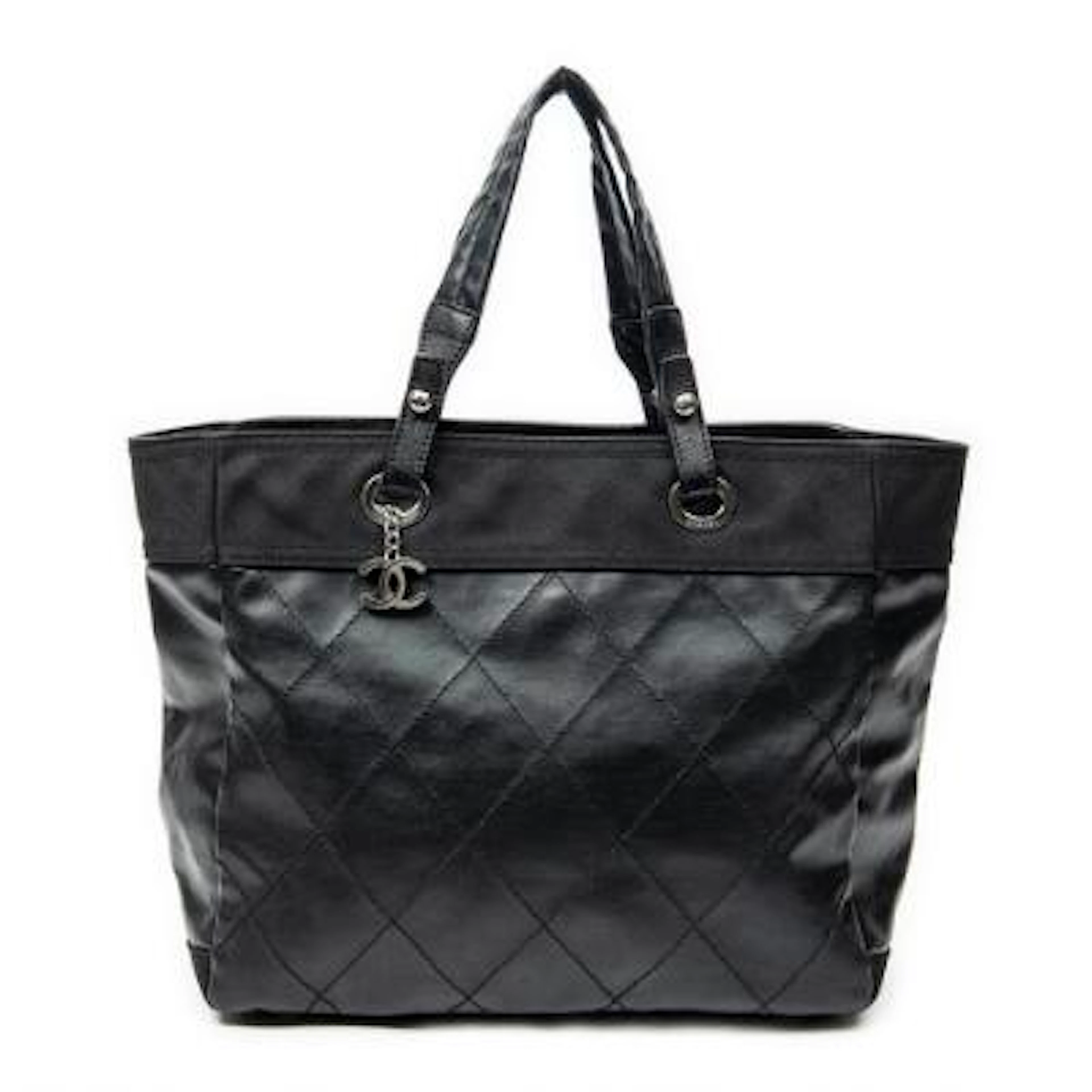 Chanel: A tote-bag of partly black quilted leather and canvas with
