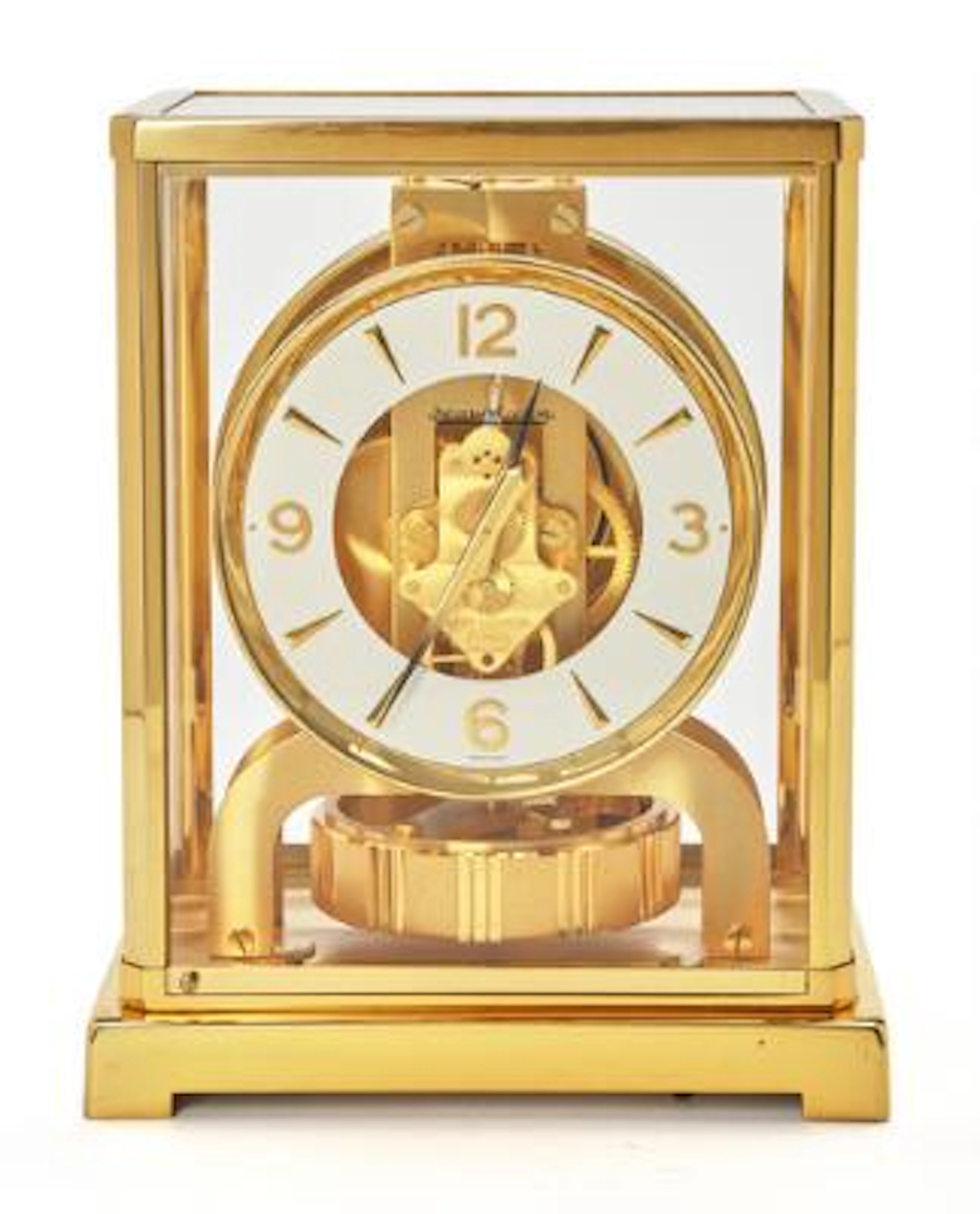Jaeger-LeCoultre: Atmos table clock of gilded brass and cut glass.