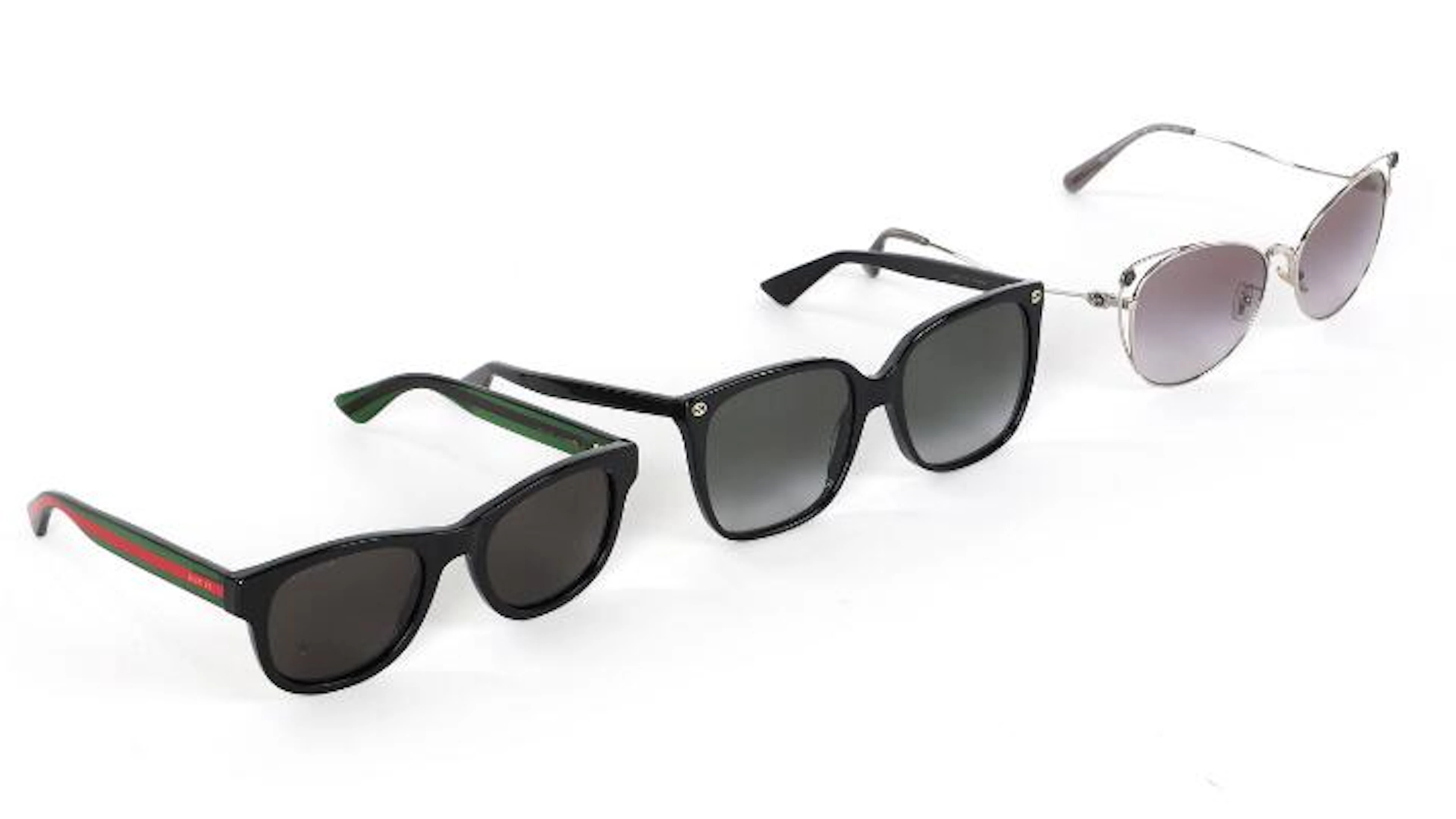 Coach, Gucci: A collection comprising of three pairs of sunglasses.